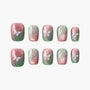 Handmade press-on nails with pink and green butterfly and floral designs, glossy finish