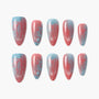 Handmade press-on nails with blue and pink gradient, bow and circle designs, glitter accents