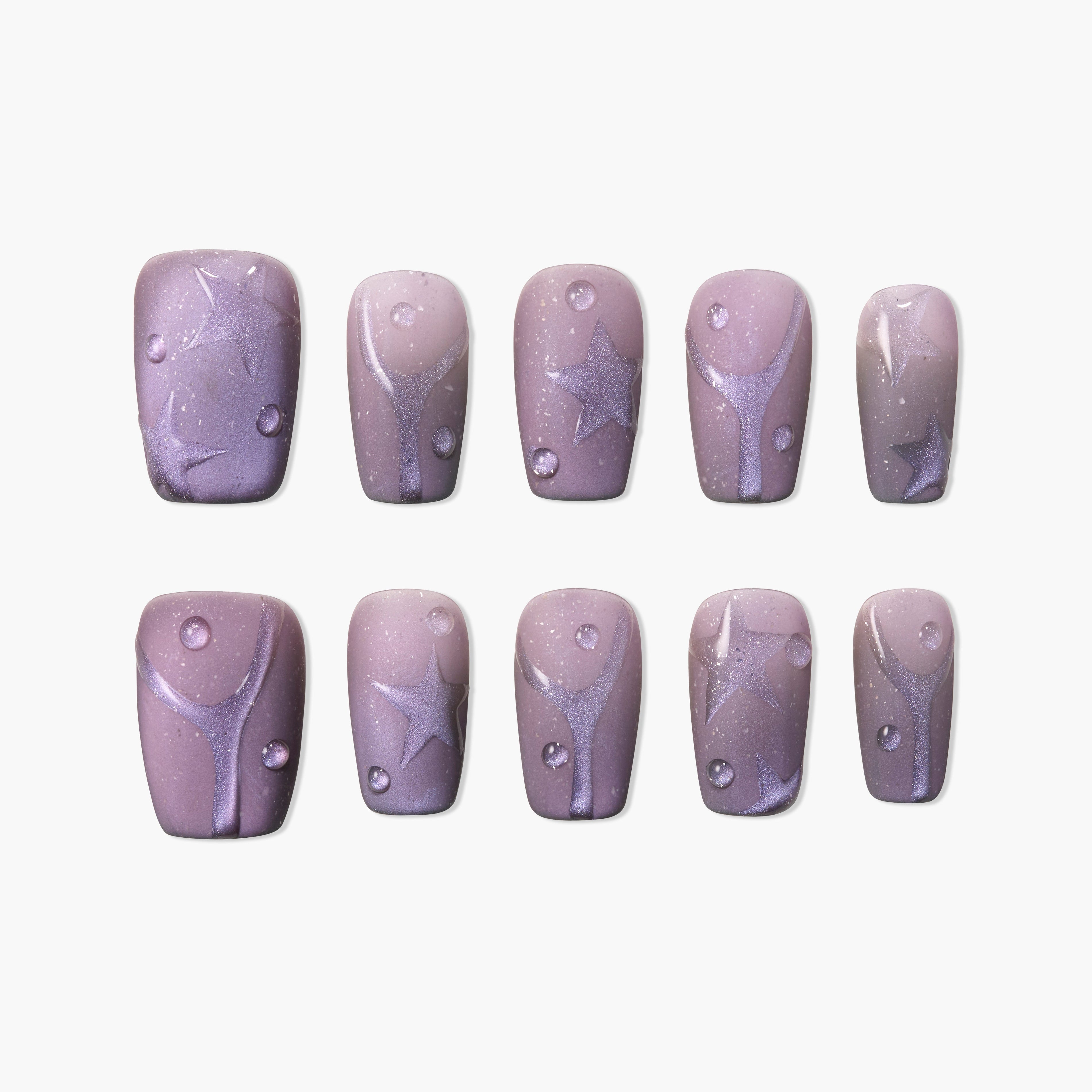 Handmade press-on nails with glittery purple star and swirl designs on mauve background