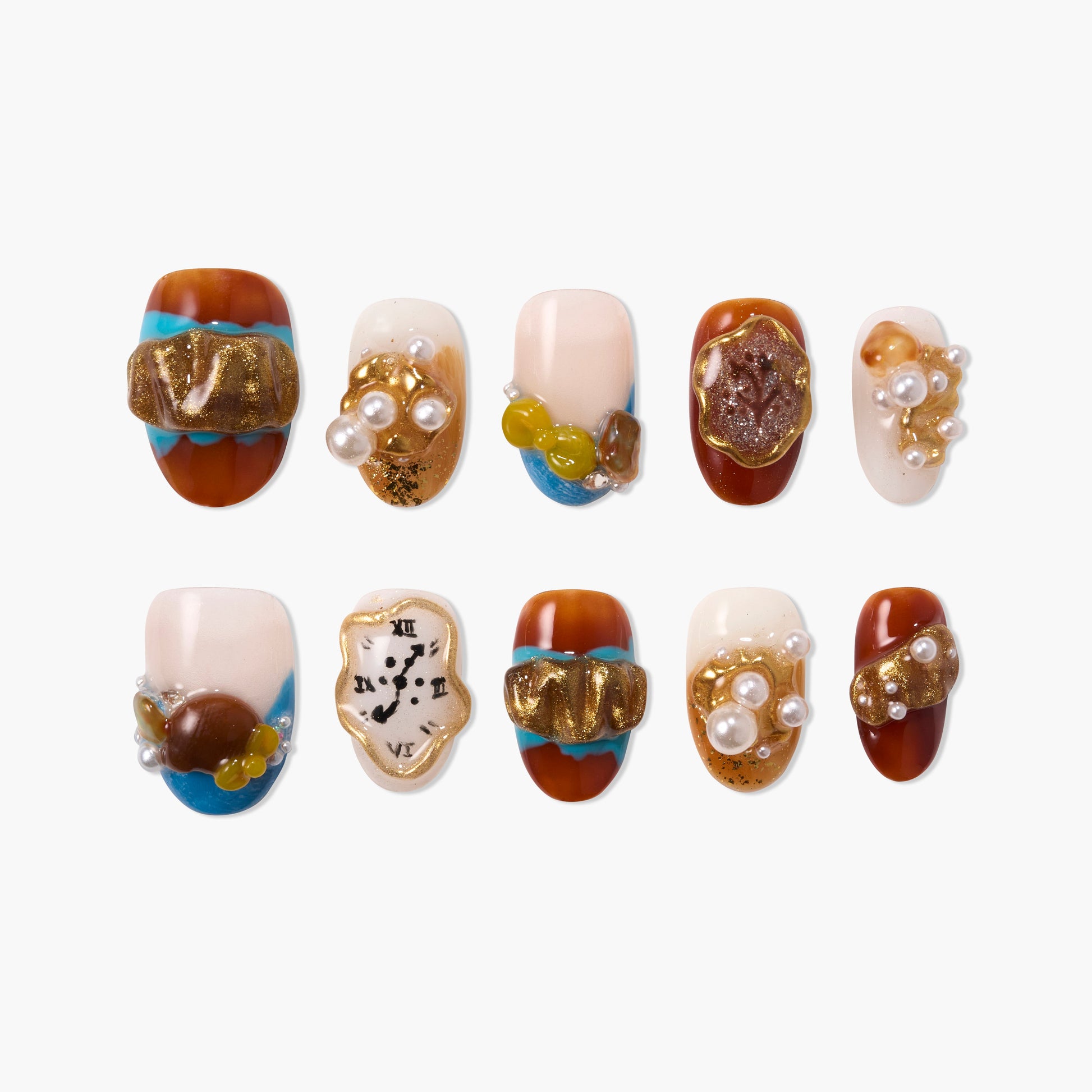 Handmade press-on nails with gold accents, pearl embellishments, blue and brown design.