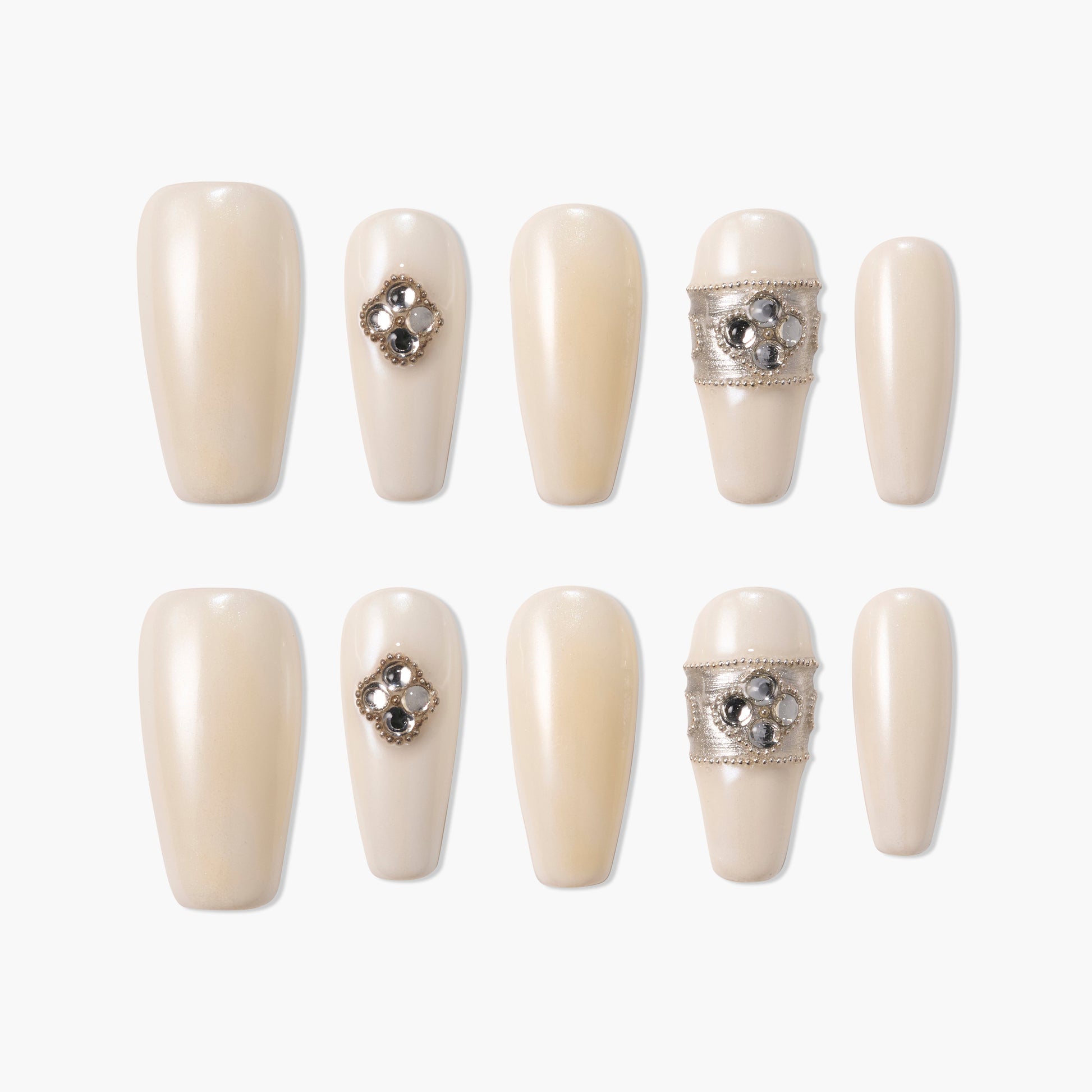 Pearl white press-on nails with jeweled accents and silver decorative bands, set of ten.