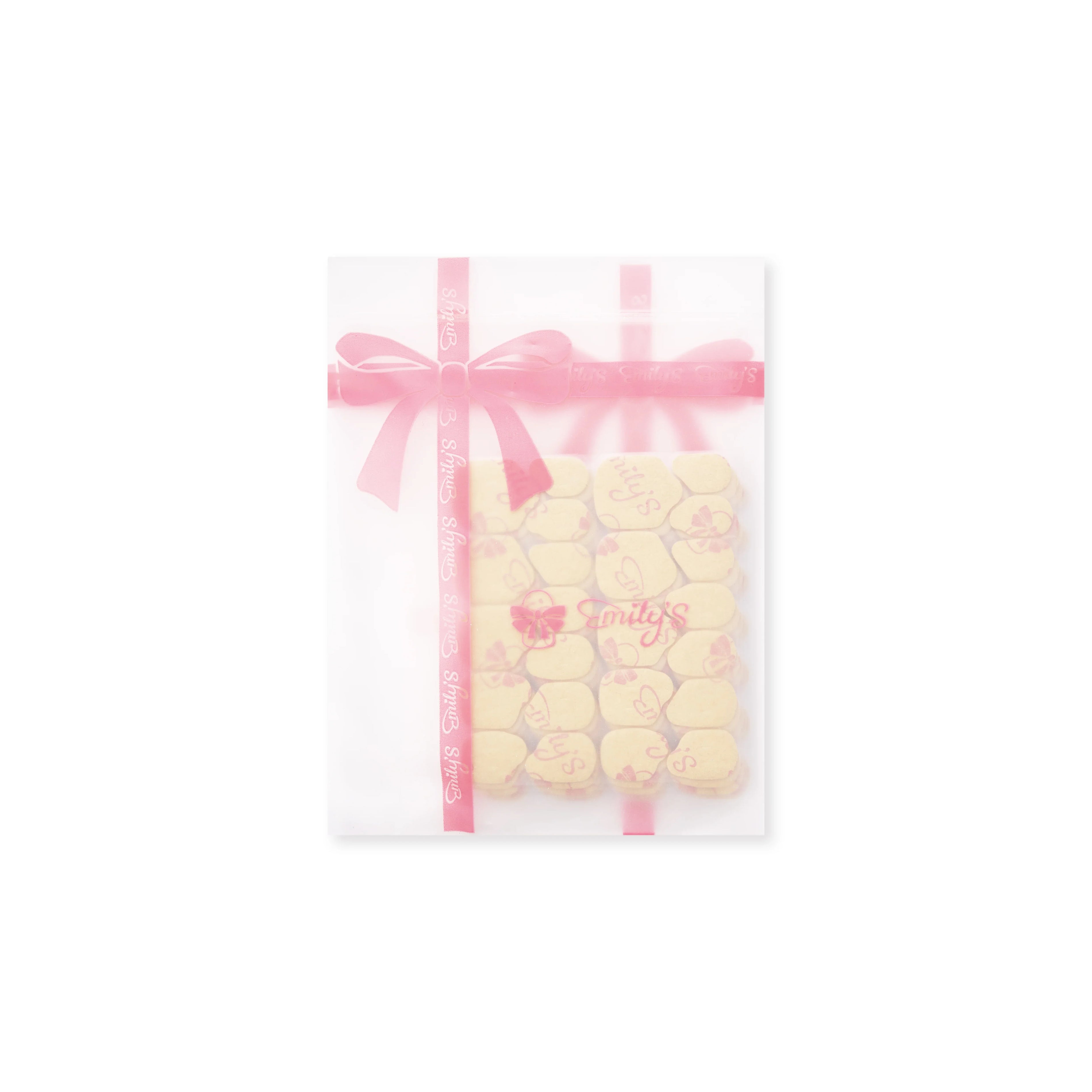 Pack of yellow sticky tabs for fingernails in a sheer pouch with pink ribbon and floral print.