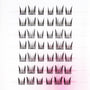 Tray of handmade false eyelash clusters with wispy, crisscross style on white background