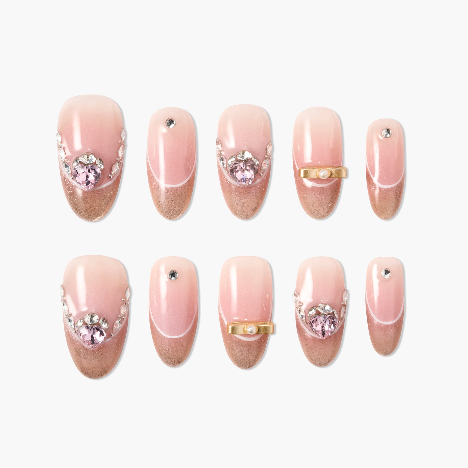 Set of pink and gold press-on nails with rhinestone, pearl, and gem accents on a white background.