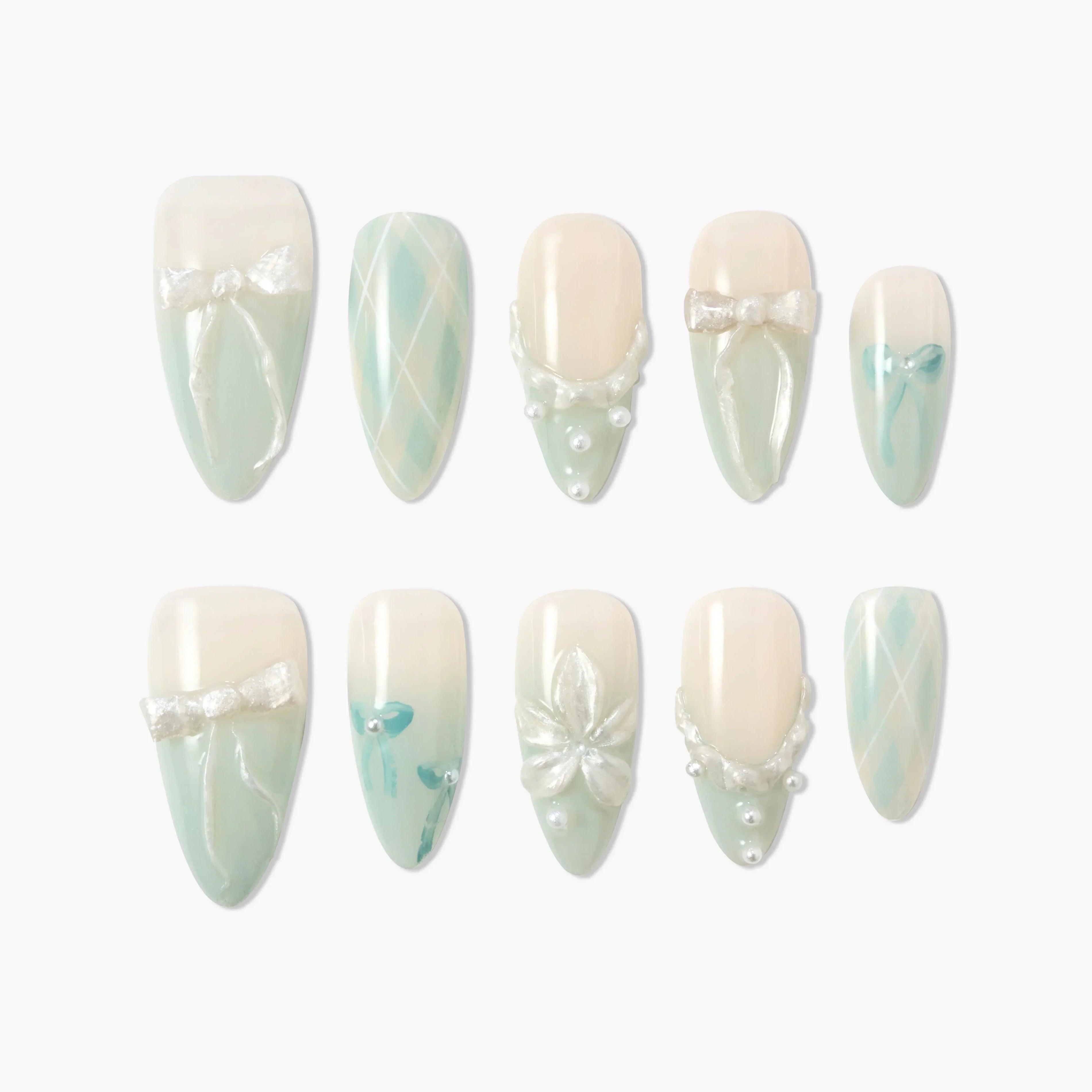 Handmade press-on nails in pastel mint and white with bow, pearl, and flower designs