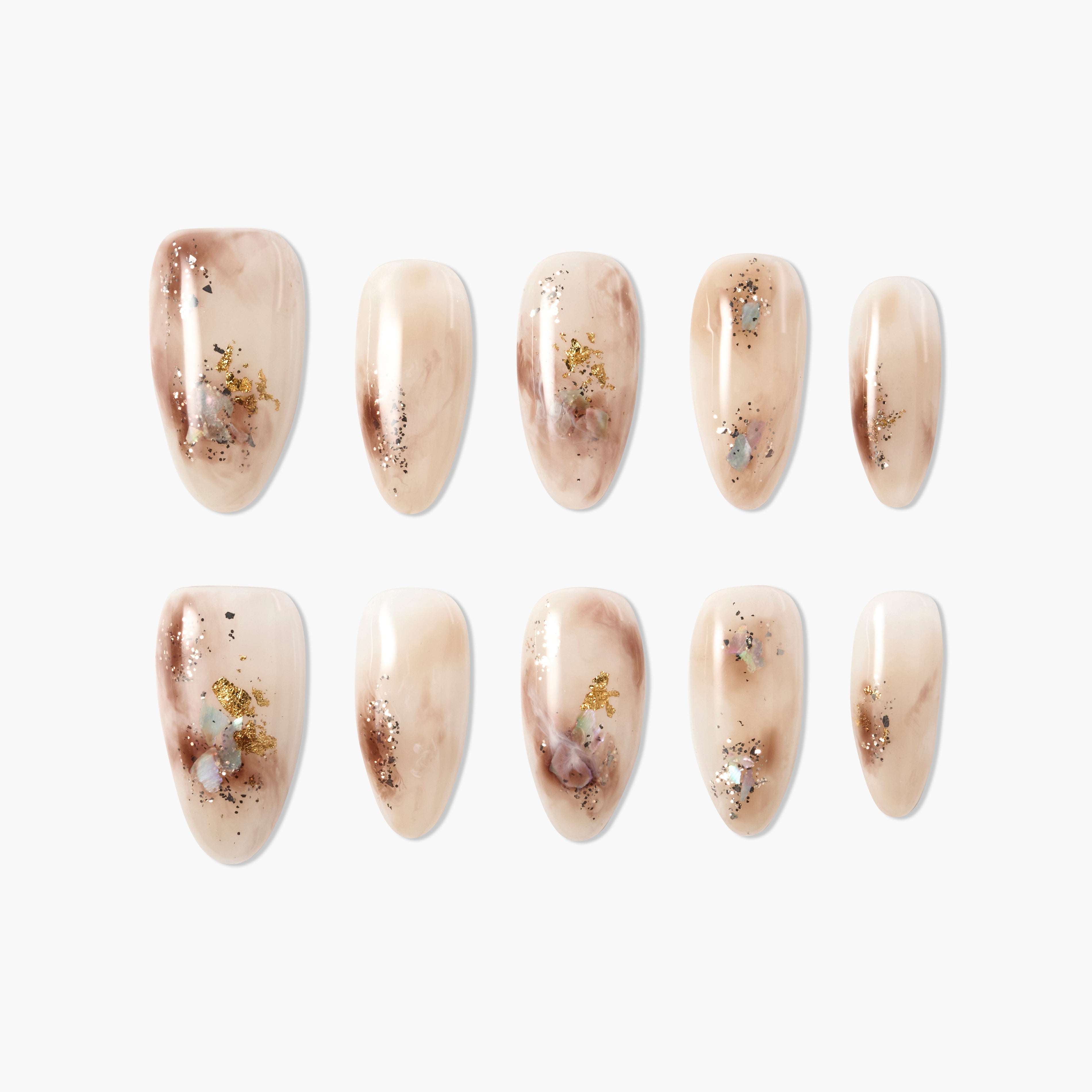 Marbled nude press-on nails with brown swirls and gold glitter accents, arranged on white background