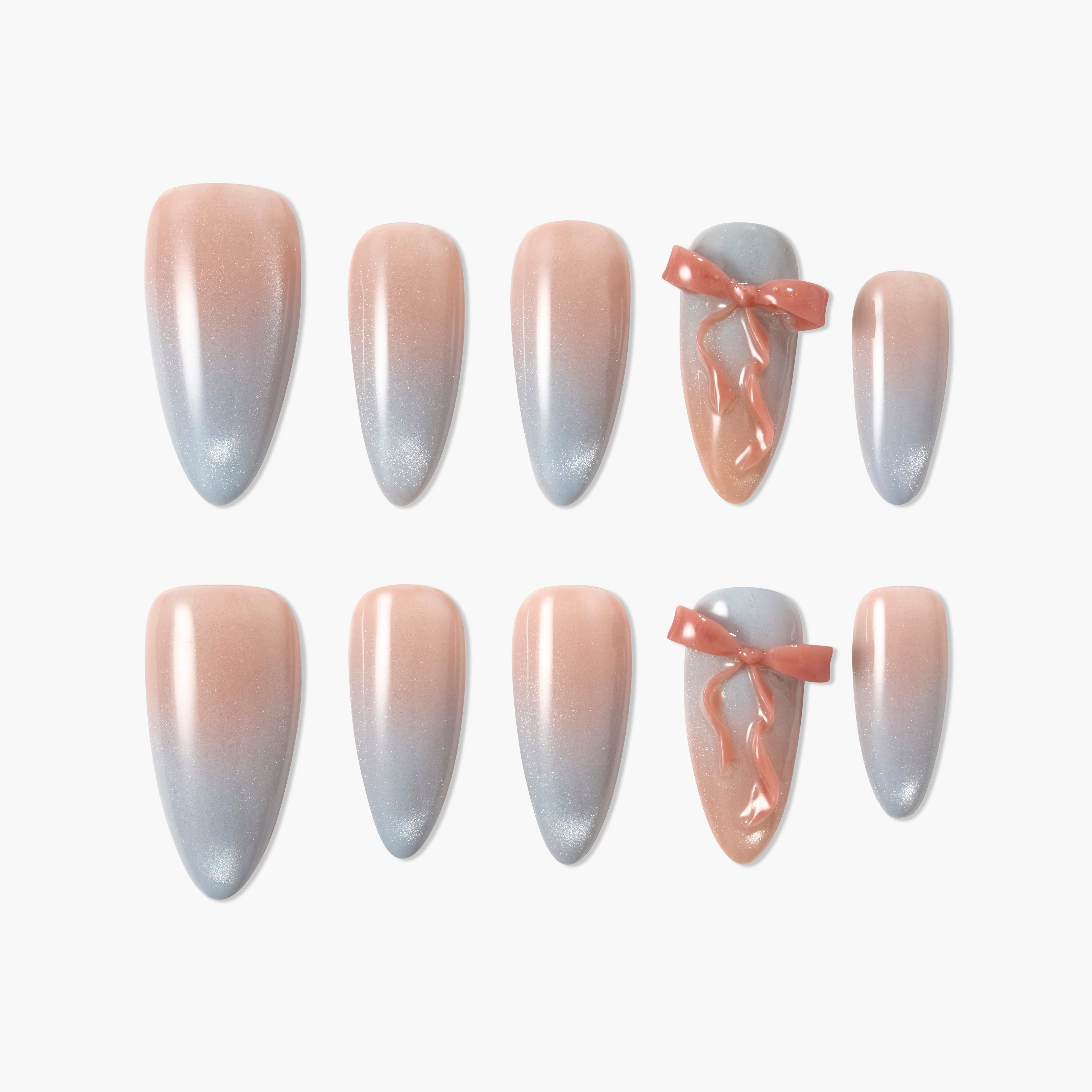 Handmade press-on nails with peach and blue ombre design and 3D pink ribbon accents.