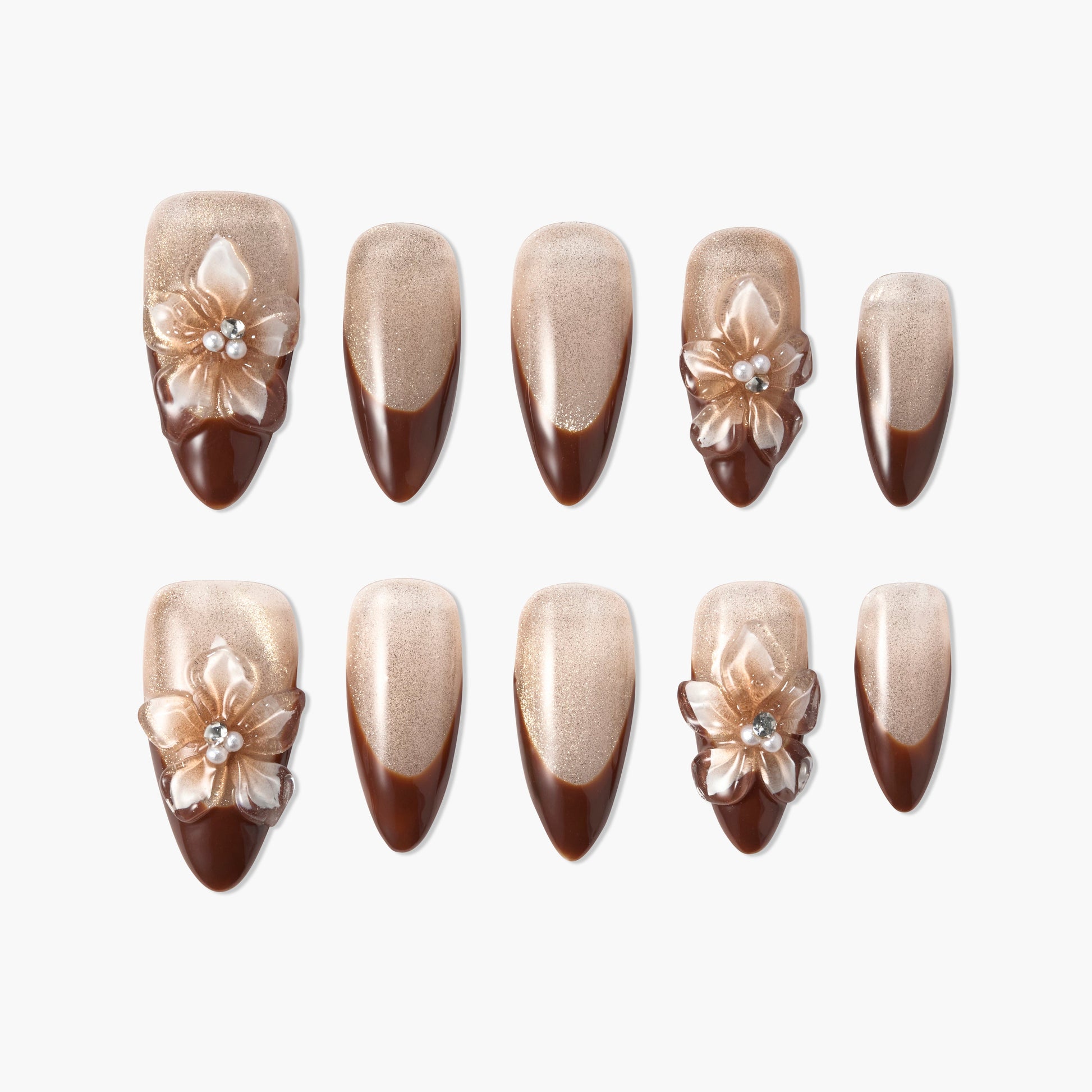 Brown and gold press-on nails with 3D floral accents and shimmering French tips