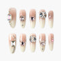 Handmade press-on nails with nude ombre base and 3D gemstone rhinestone accents