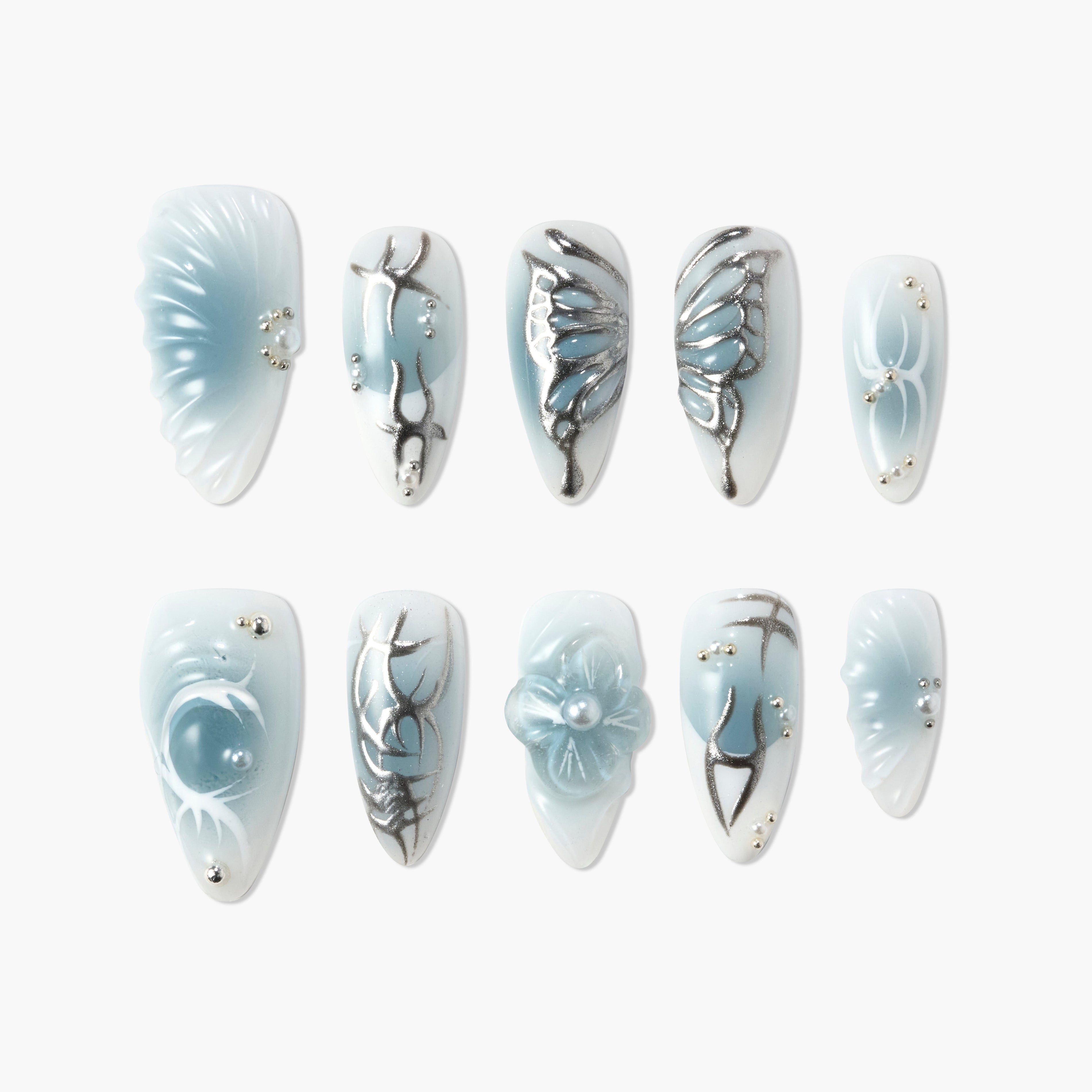 Blue and white handmade press-on nails with 3D floral and silver metallic accents