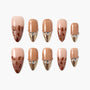 Set of brown and gold press-on nails with rhinestone accents and tortoiseshell design