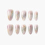 Handmade press-on nails with pastel marble design and gold foil accents on white background