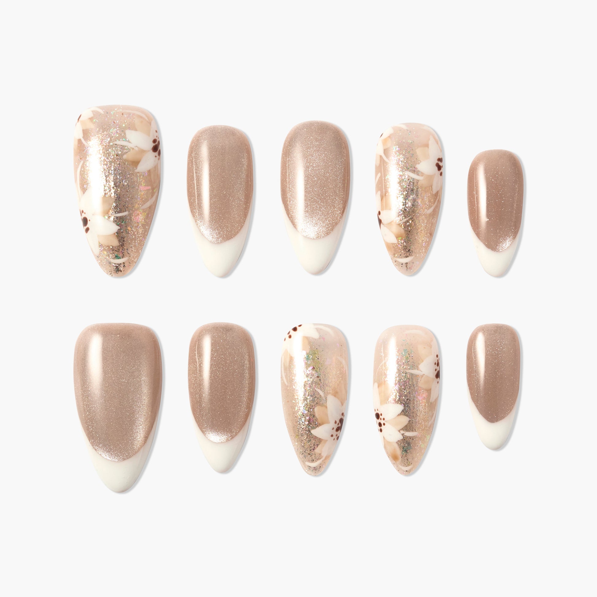 Handmade press-on nails with nude shimmer, French tips, and floral glitter accents