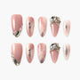 Handmade pink press-on nails with silver glitter and large gemstone embellishments