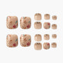 Handmade press-on toenails with floral and gold bead designs on a nude base, reusable nail set.