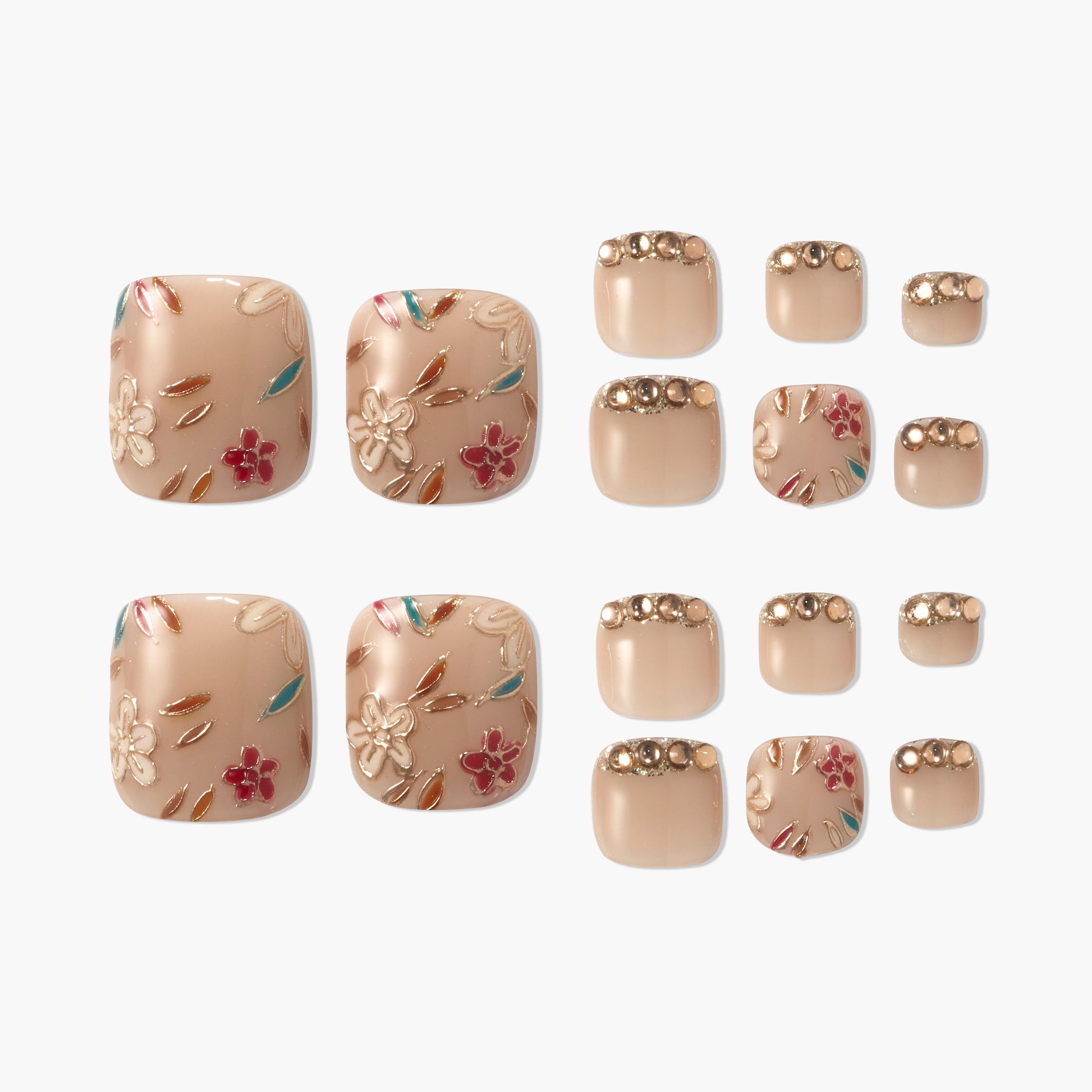 Handmade press-on toenails with floral and gold bead designs on a nude base, reusable nail set.