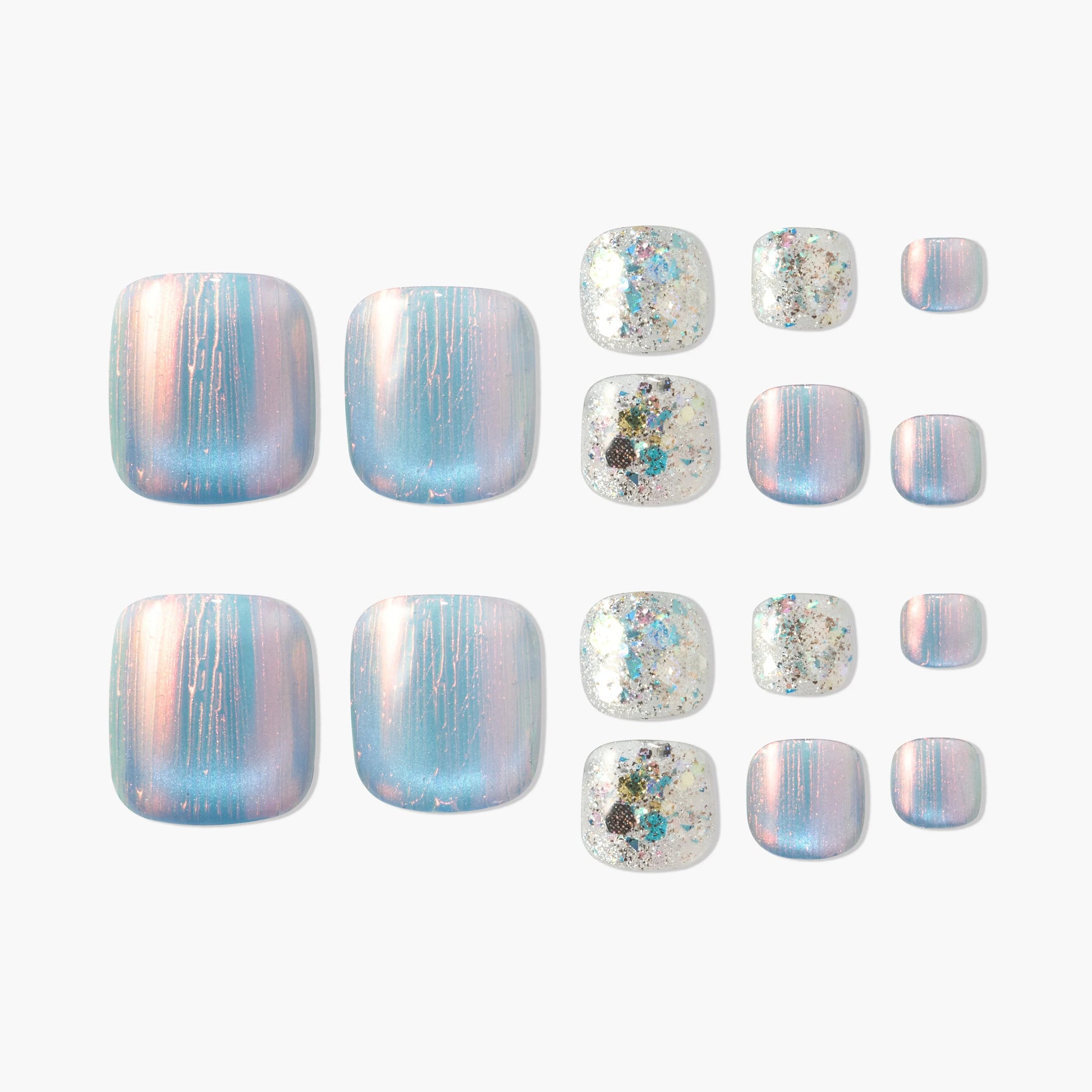 Iridescent blue and pink press-on nails with glitter accent designs, displayed on white background