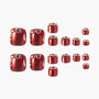 Red press-on toenails with silver rhinestone accents, arranged on a white background.