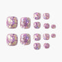 Set of iridescent pink and gold glitter press-on toenails on a white background