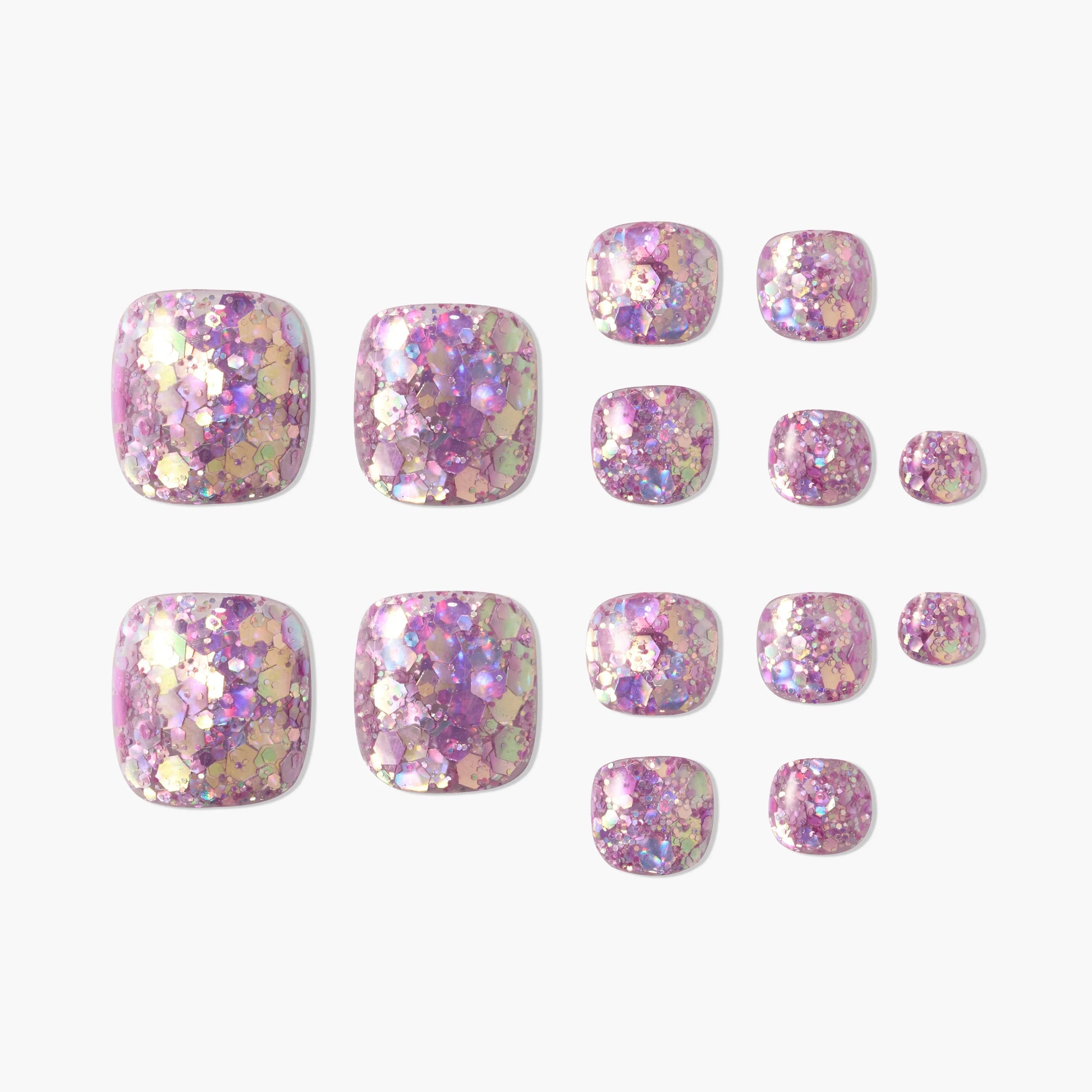 Set of iridescent pink and gold glitter press-on toenails on a white background