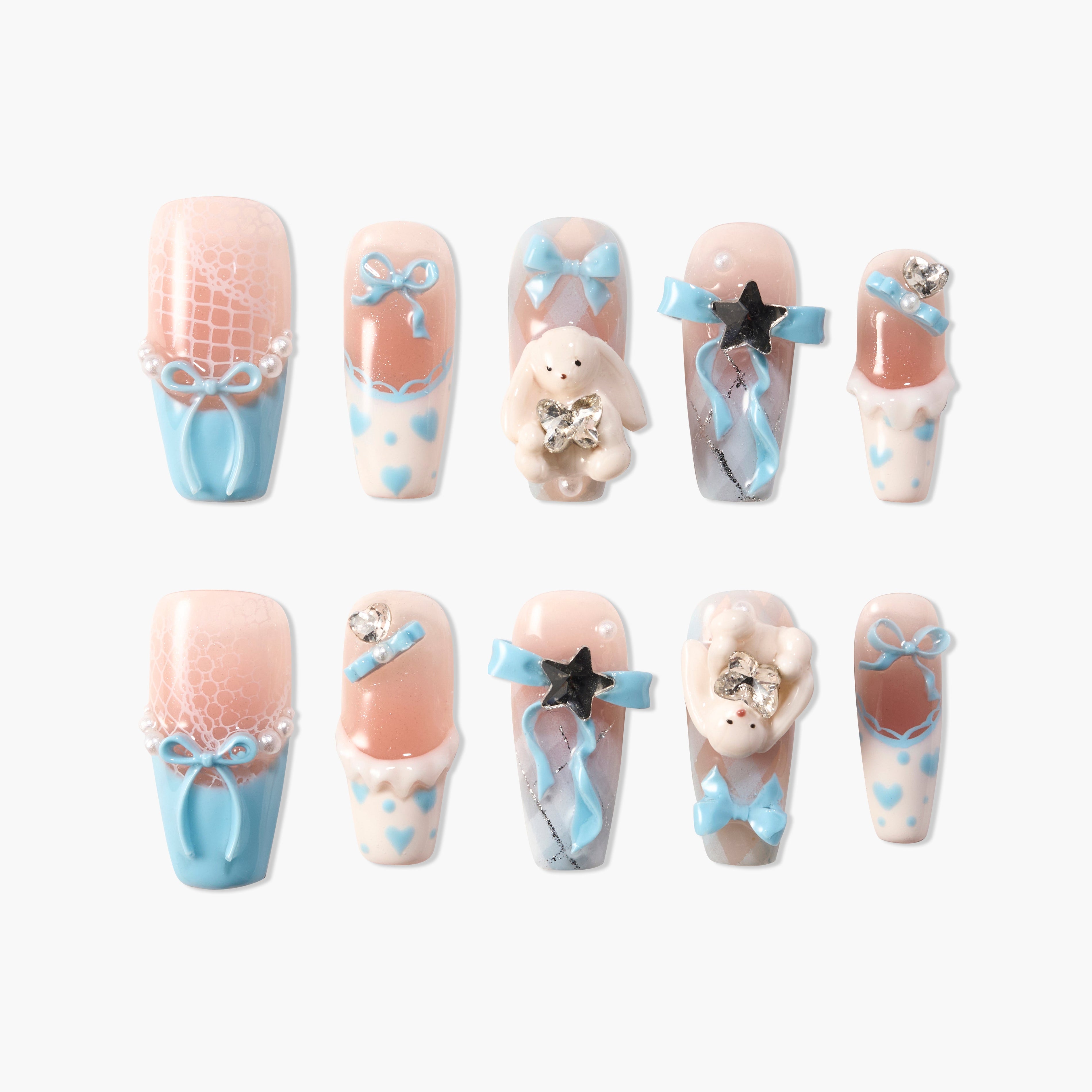 Handmade press-on nails with pastel blue bows, heart patterns, and 3D bunny accents