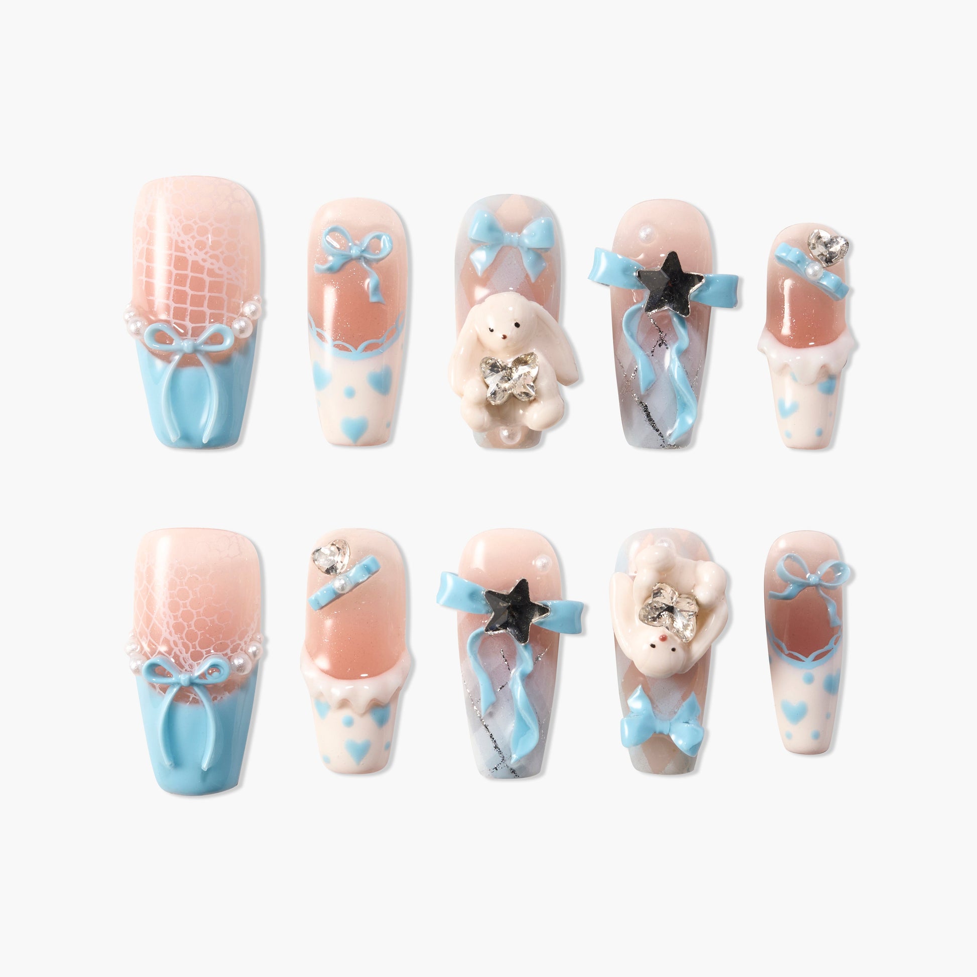 Handmade press-on nails with pastel blue bows, heart patterns, and 3D bunny accents