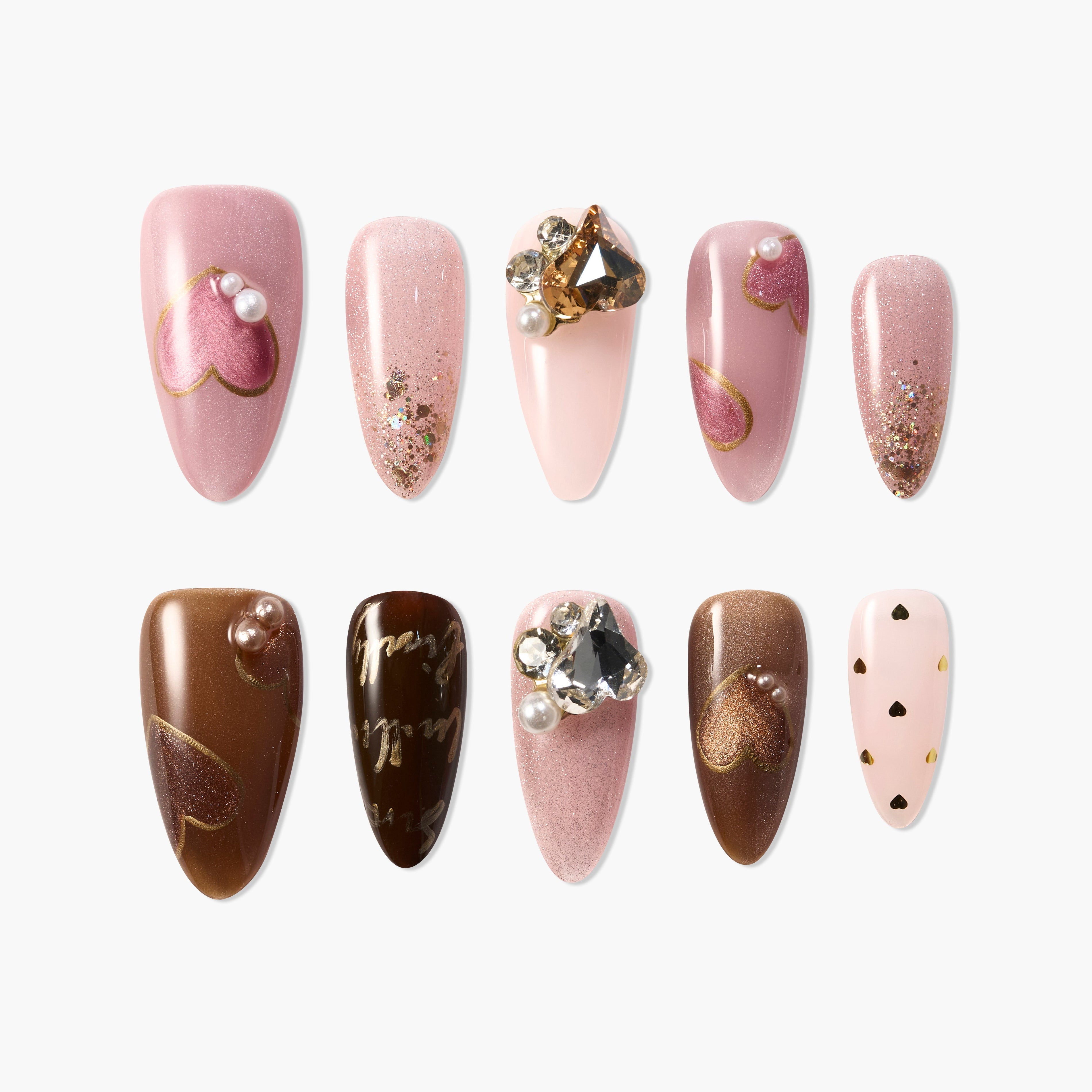 Handmade press-on nails in pink and brown shades with heart designs, pearls, and rhinestones