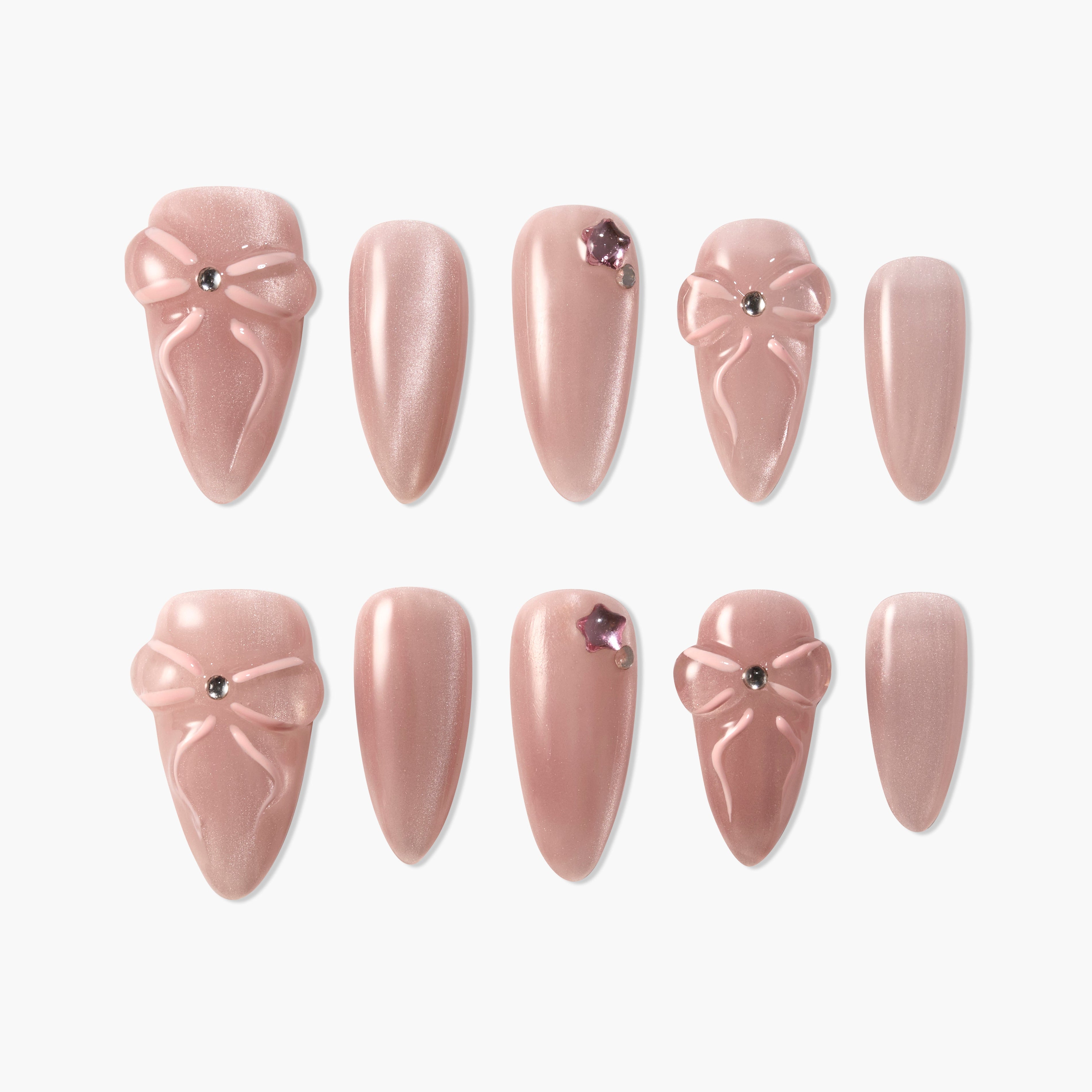 Set of pink press-on nails with 3D bow designs and rhinestone accents on a white background