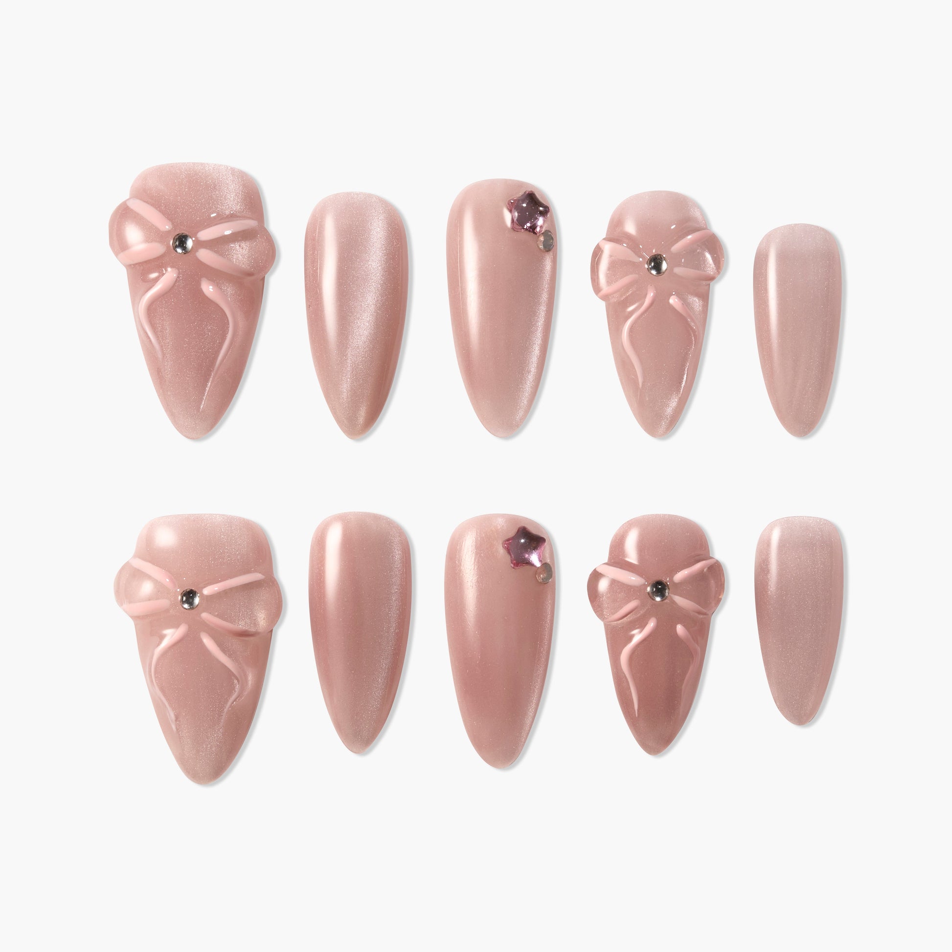 Set of pink press-on nails with 3D bow designs and rhinestone accents on a white background