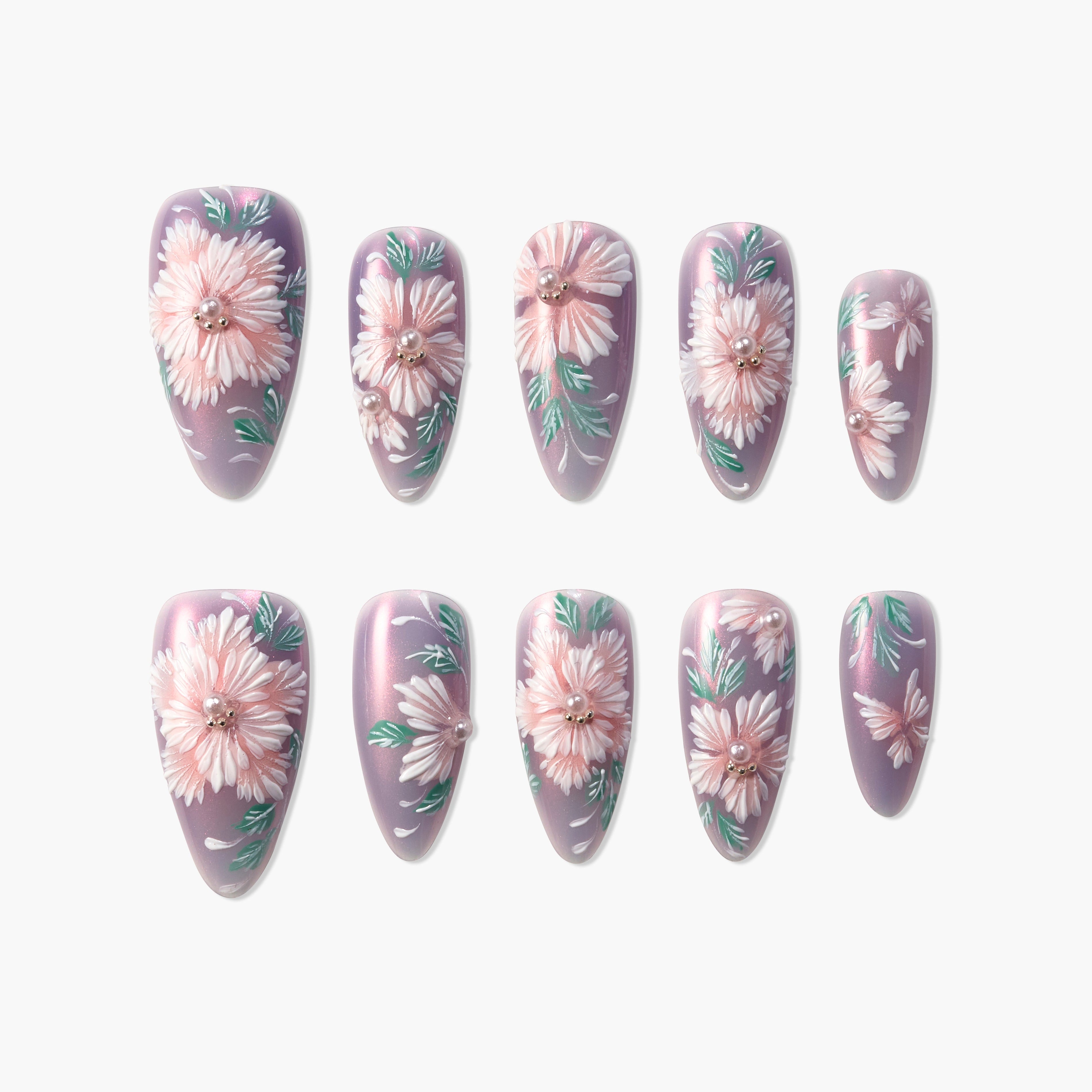 Handmade press-on nails with pink floral design and pearl accents on a shimmery lavender base