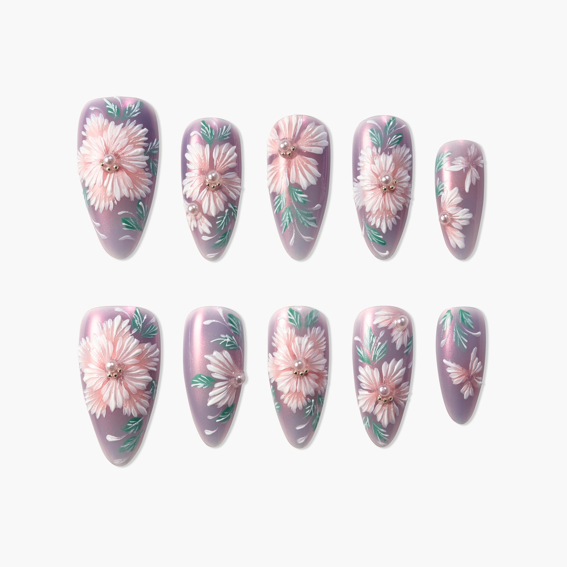 Handmade press-on nails with pink floral design and pearl accents on a shimmery lavender base
