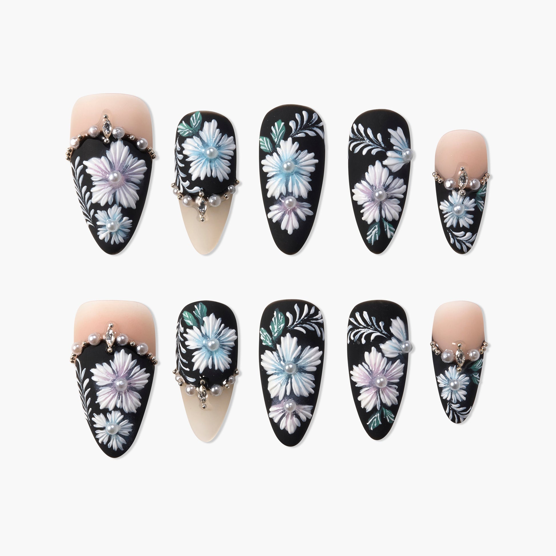Black press-on nails with 3D white floral design and pearl rhinestone accents