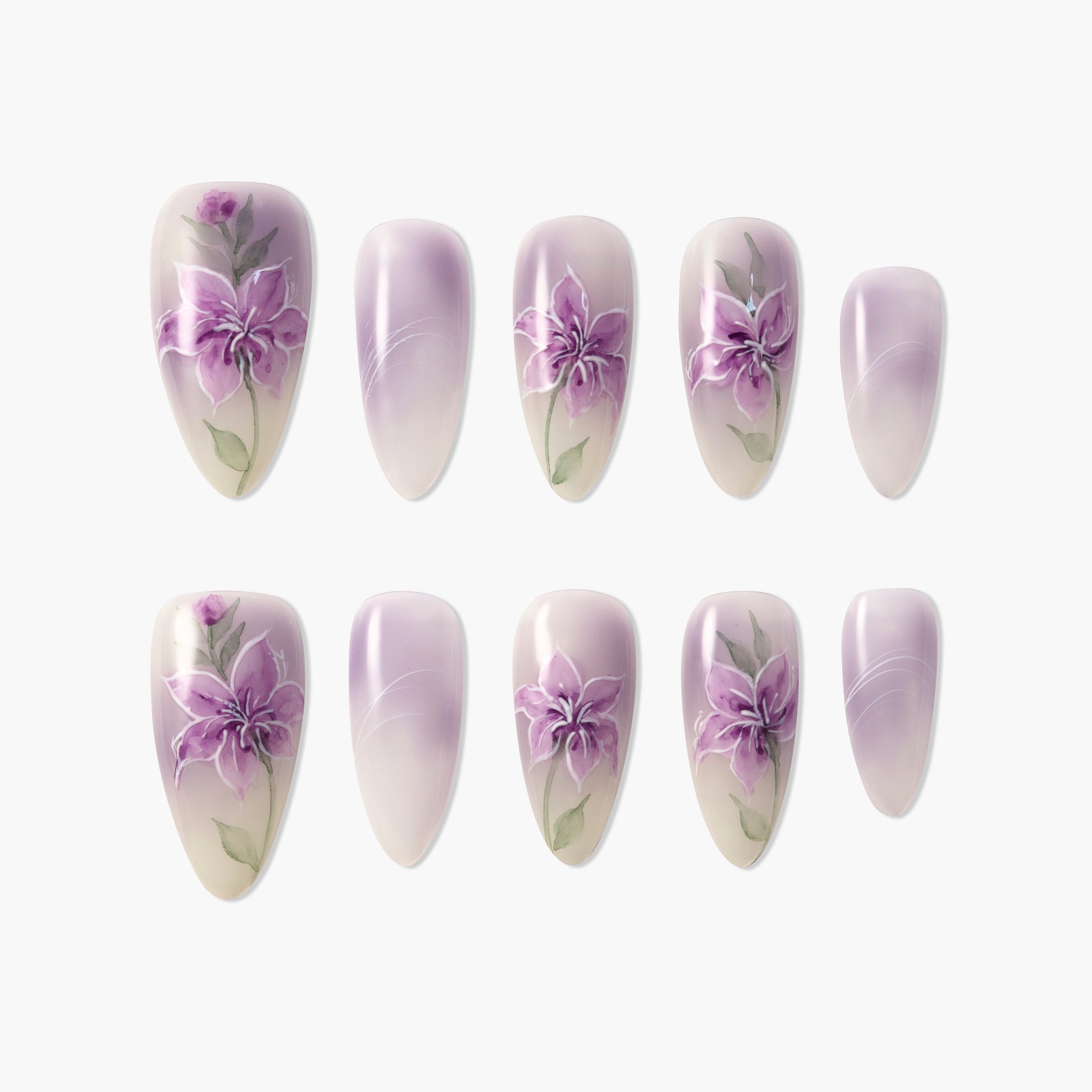 Set of handmade press-on nails with purple floral and gradient designs on a white background