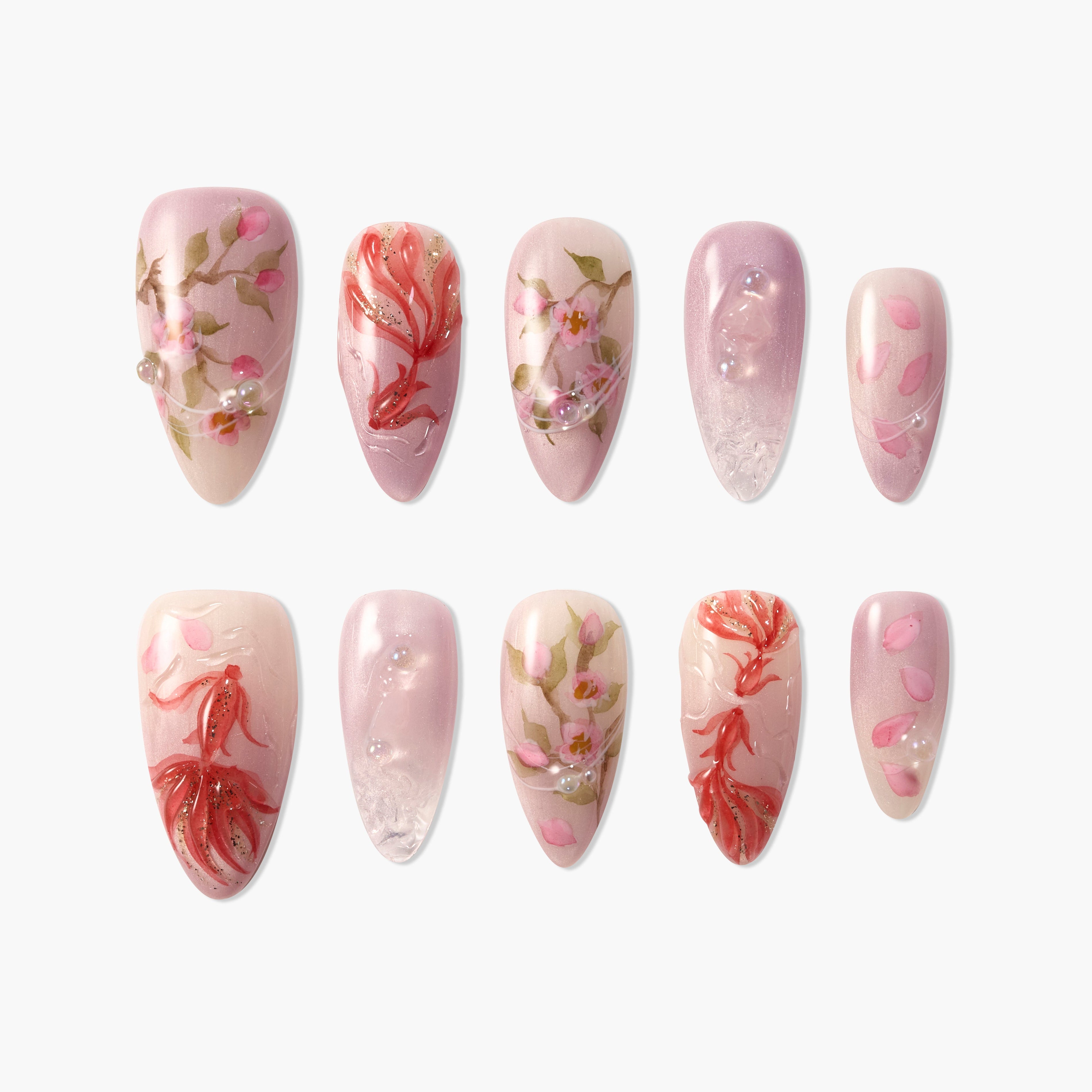 Handmade press-on nails with pink floral designs, gold accents, and pearl embellishments