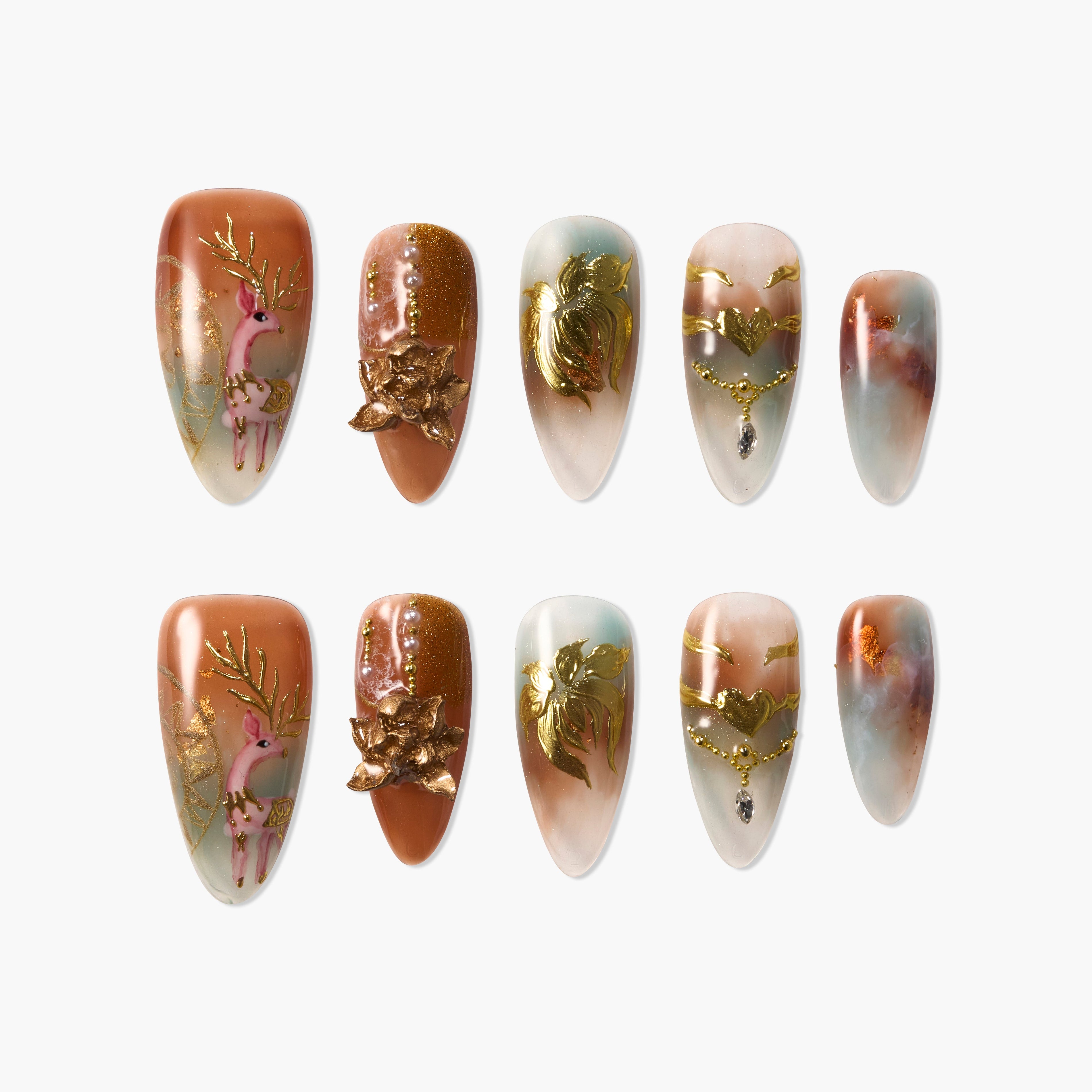 Handmade press-on nails set with gold reindeer, floral, and marble designs on mixed pastel hues