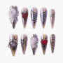 Handmade press-on nails with 3D flowers, hearts, butterflies, bows, and metallic accents