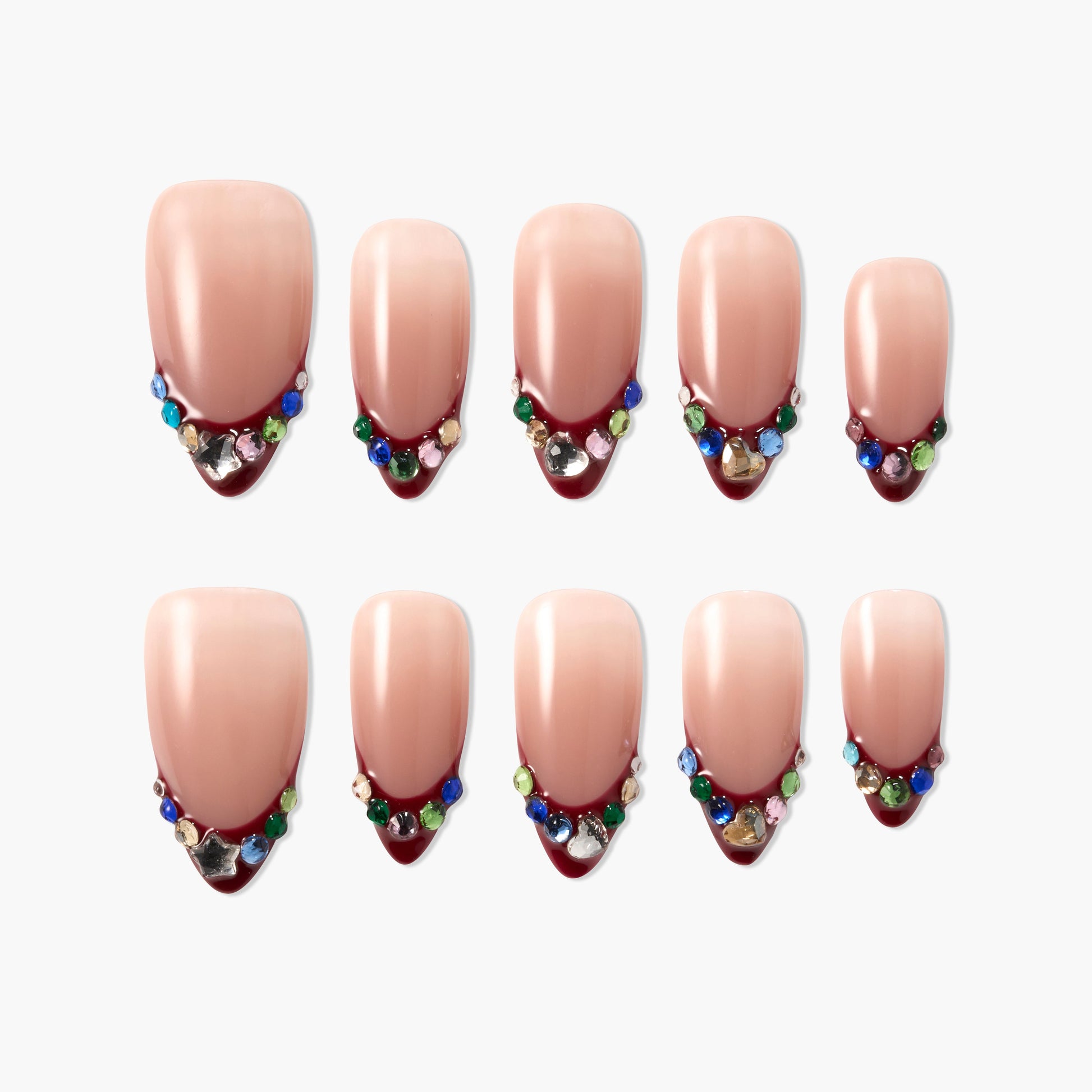 Handmade press-on nails with nude base, burgundy tips, and multicolored gem accents