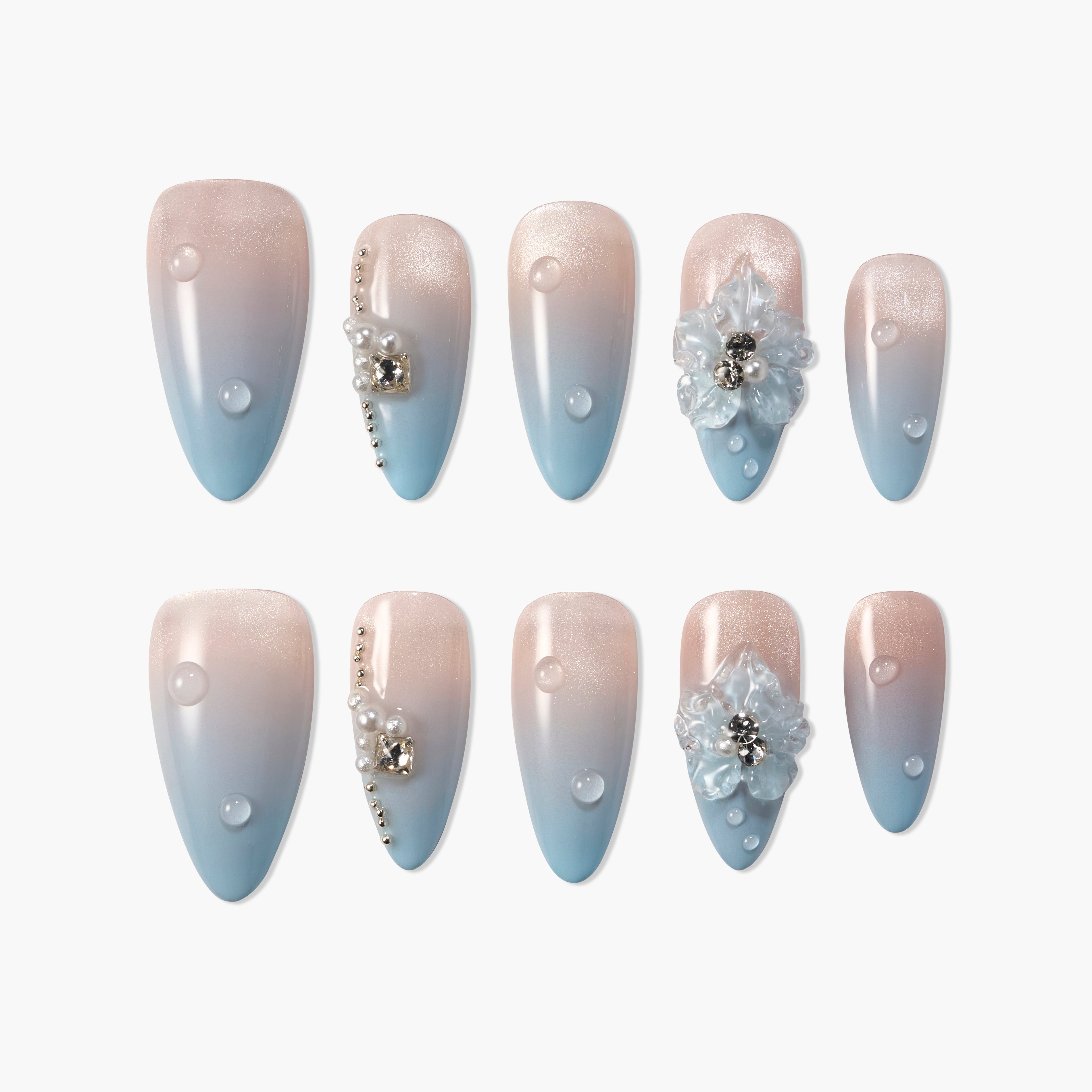 Blue and nude ombre press-on nails with pearls, rhinestones, and 3D floral accents