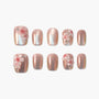 Handmade rose gold press-on nails with 3D pink flower and crystal accents, set of ten.