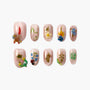 Handmade press-on nails with pastel pink base and 3D floral and insect designs.