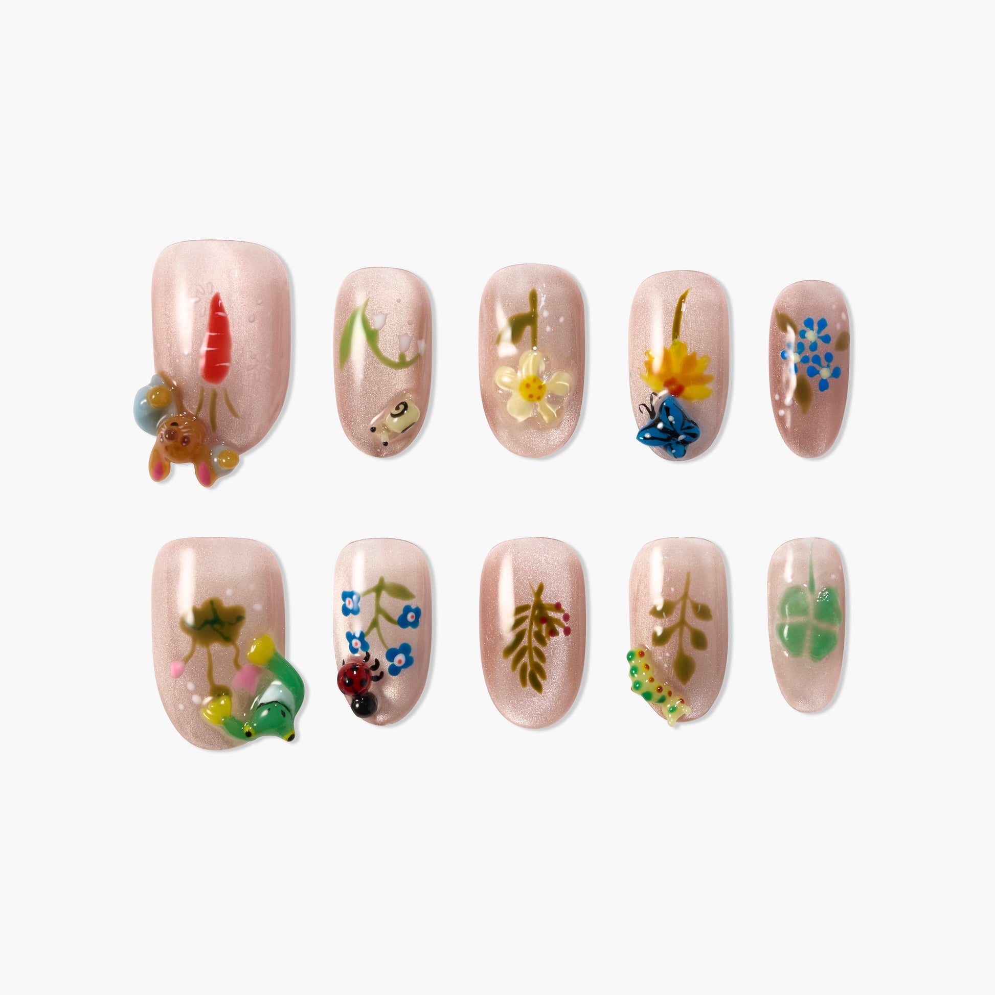 Handmade press-on nails with pastel pink base and 3D floral and insect designs.