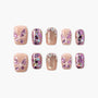 Handmade press-on nails with nude base, 3D purple butterfly accents, and sparkling glitter designs