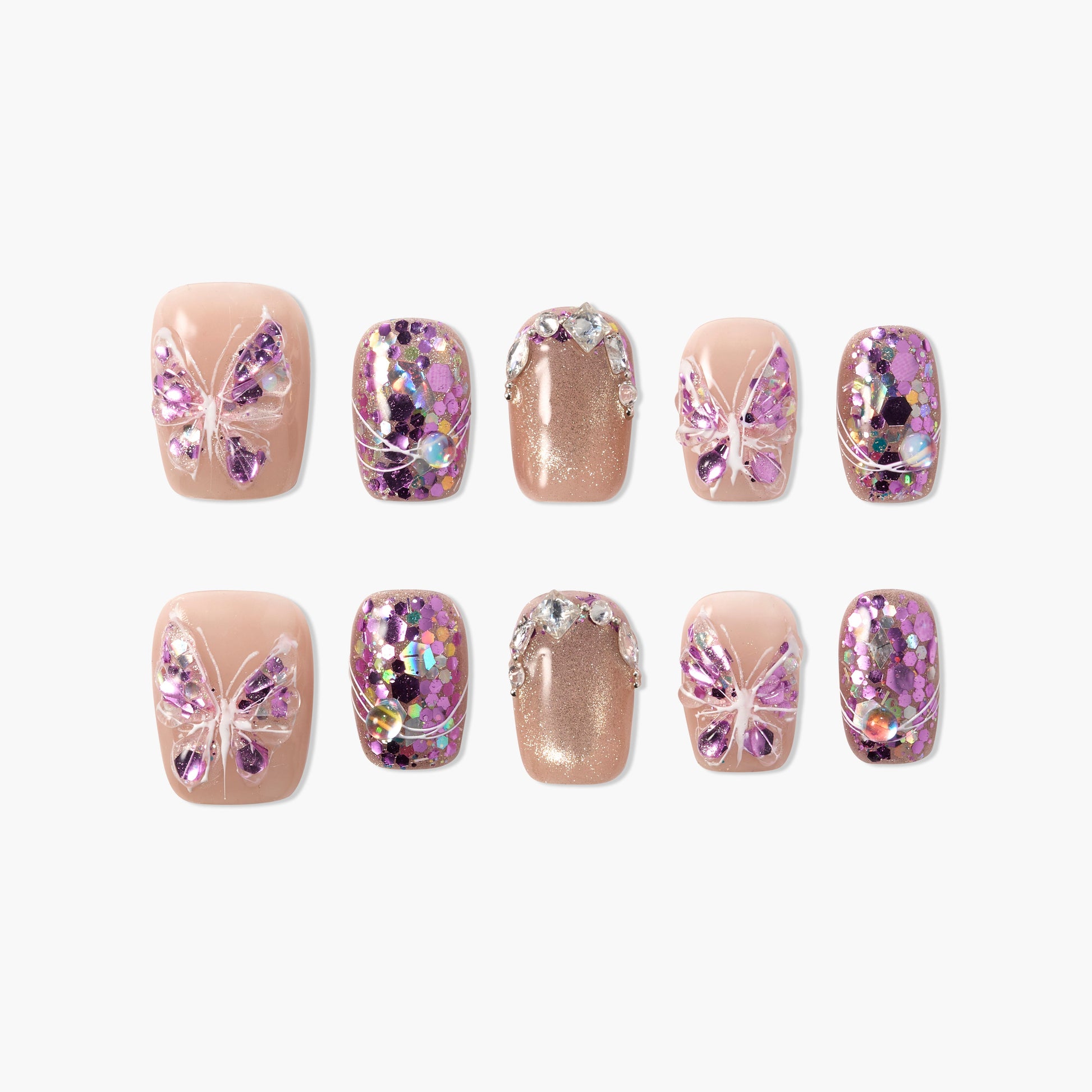 Handmade press-on nails with nude base, 3D purple butterfly accents, and sparkling glitter designs