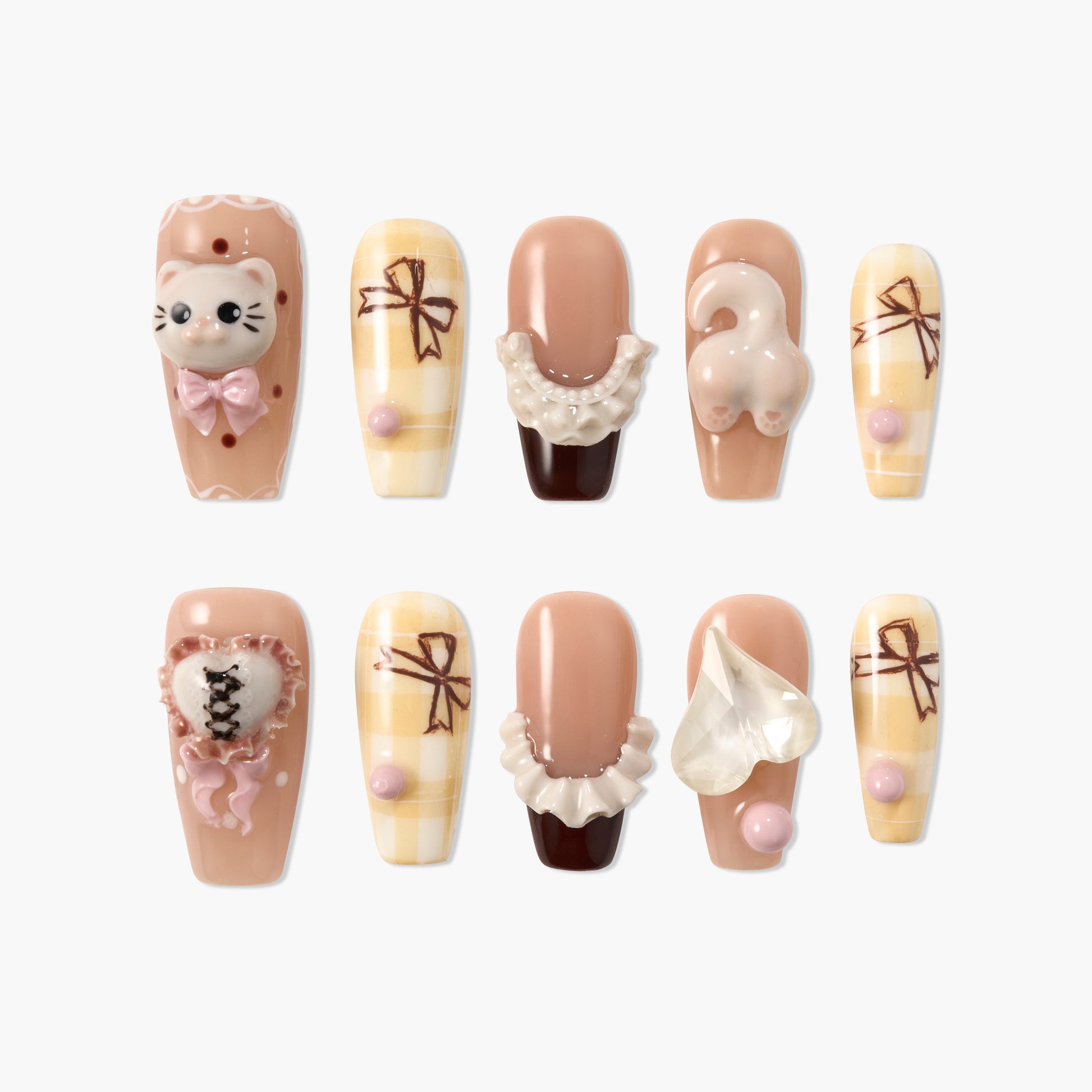 Cute handmade press-on nails with 3D cat, bows, lace, and heart designs in beige and pink tones.