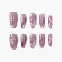 Handmade mauve press-on nails with 3D jellyfish, pearl and glitter accents, glossy finish