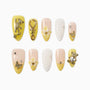 Yellow and nude handmade press-on nails with 3D bear, flower, pearl, and rhinestone designs