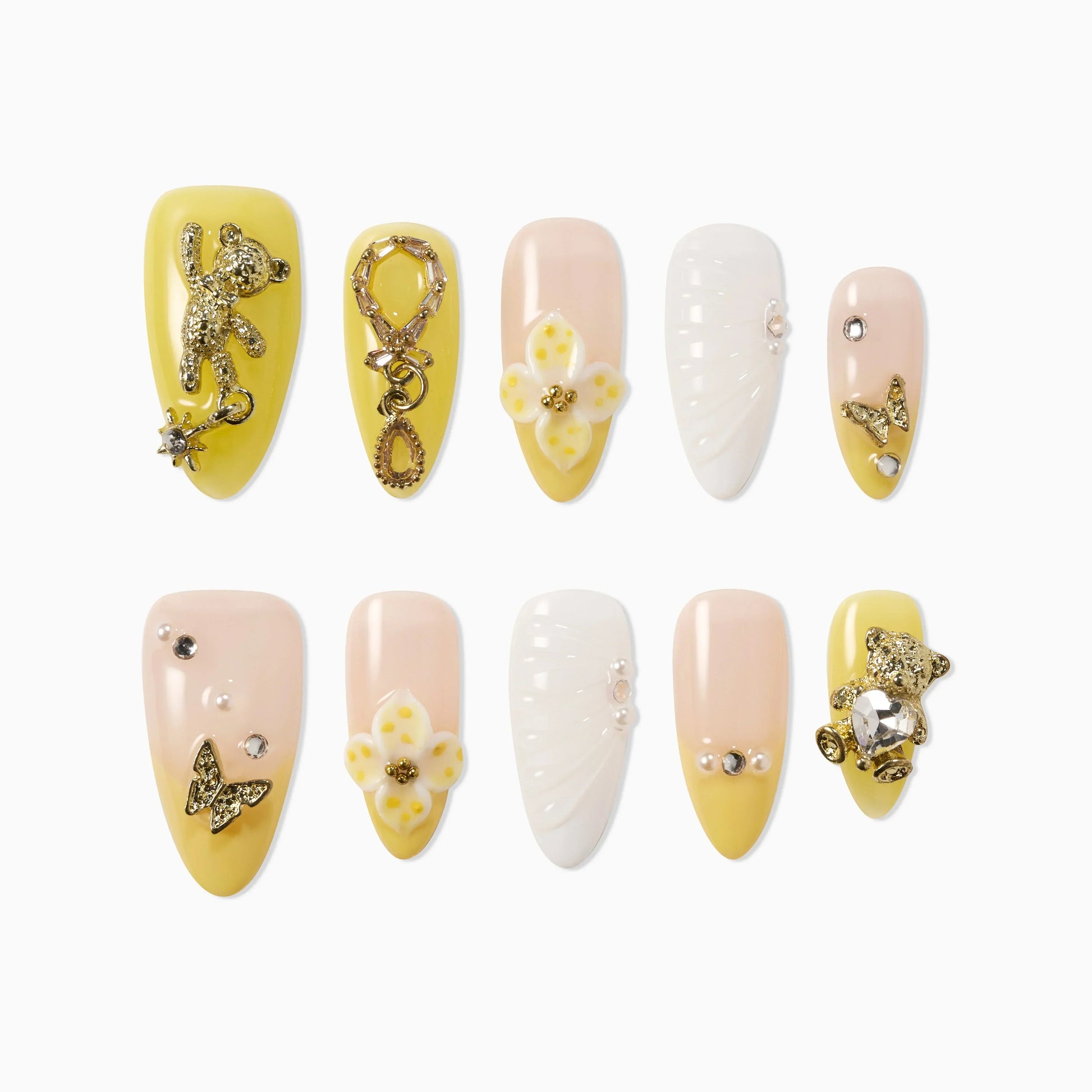 Yellow and nude handmade press-on nails with 3D bear, flower, pearl, and rhinestone designs