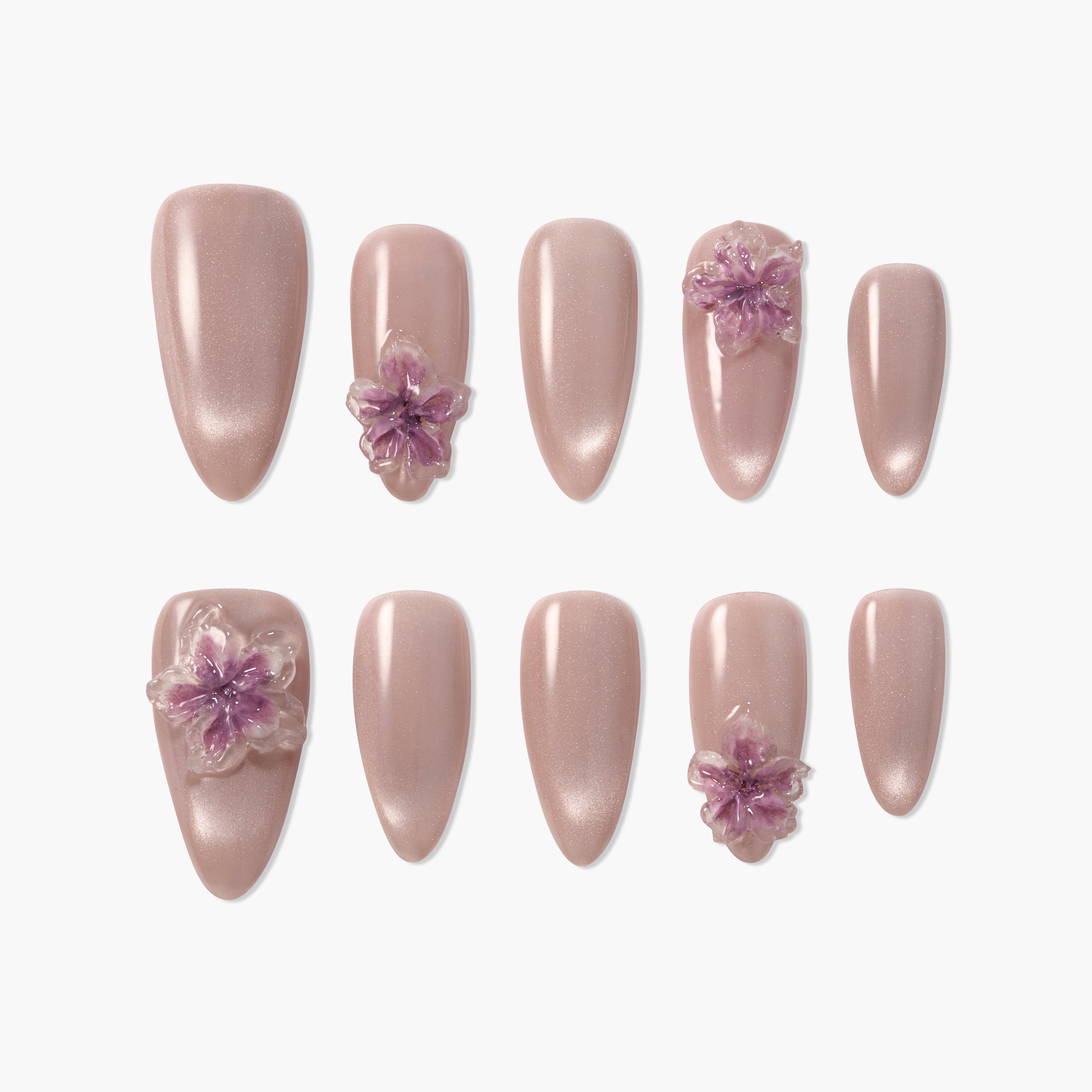 Handmade pink press-on nails with 3D purple floral accents, medium almond shape