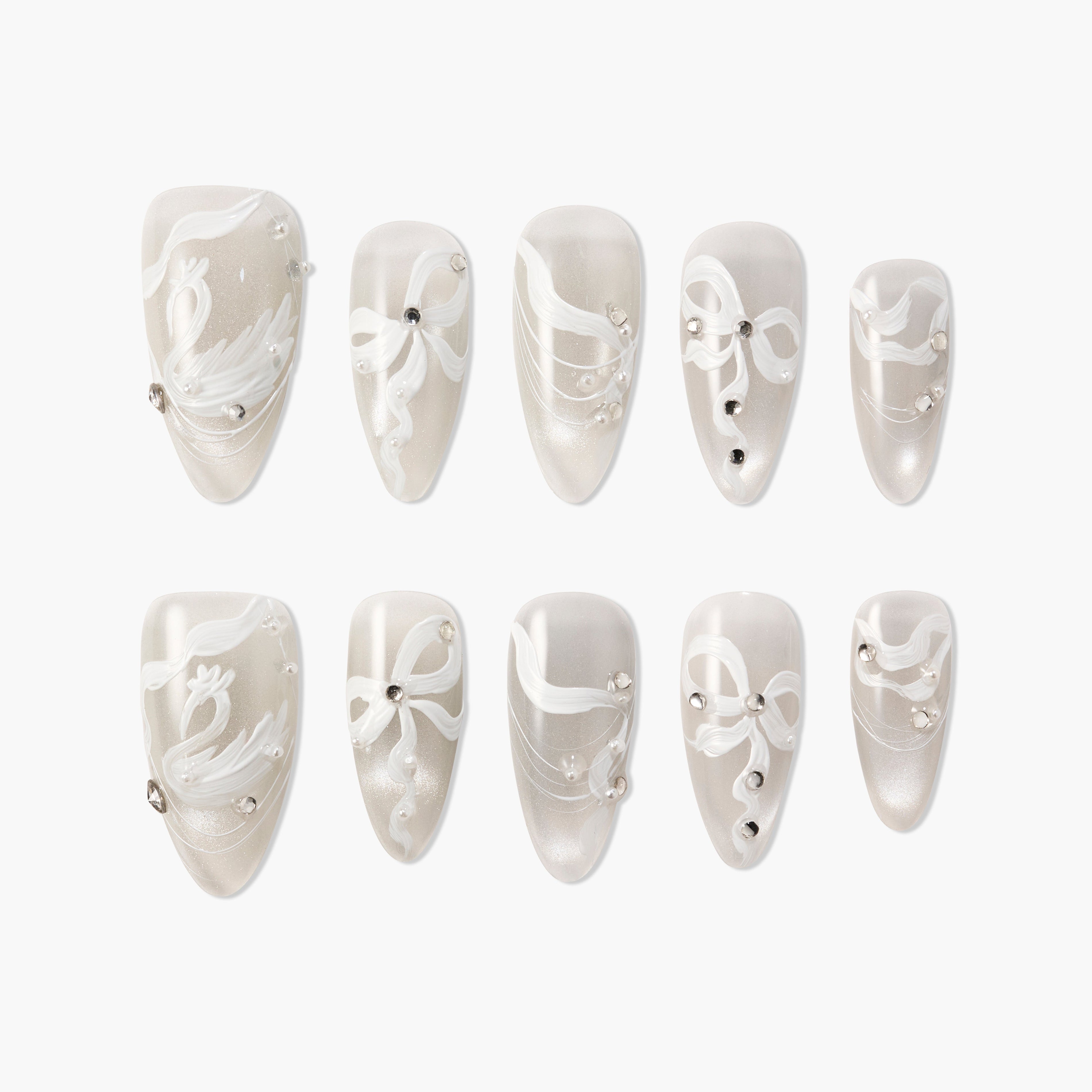 Handmade press-on nails with pearly white base, white swirl designs, and rhinestone accents