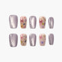 Handmade press-on nails with purple metallic polish, floral designs, and rhinestone accents